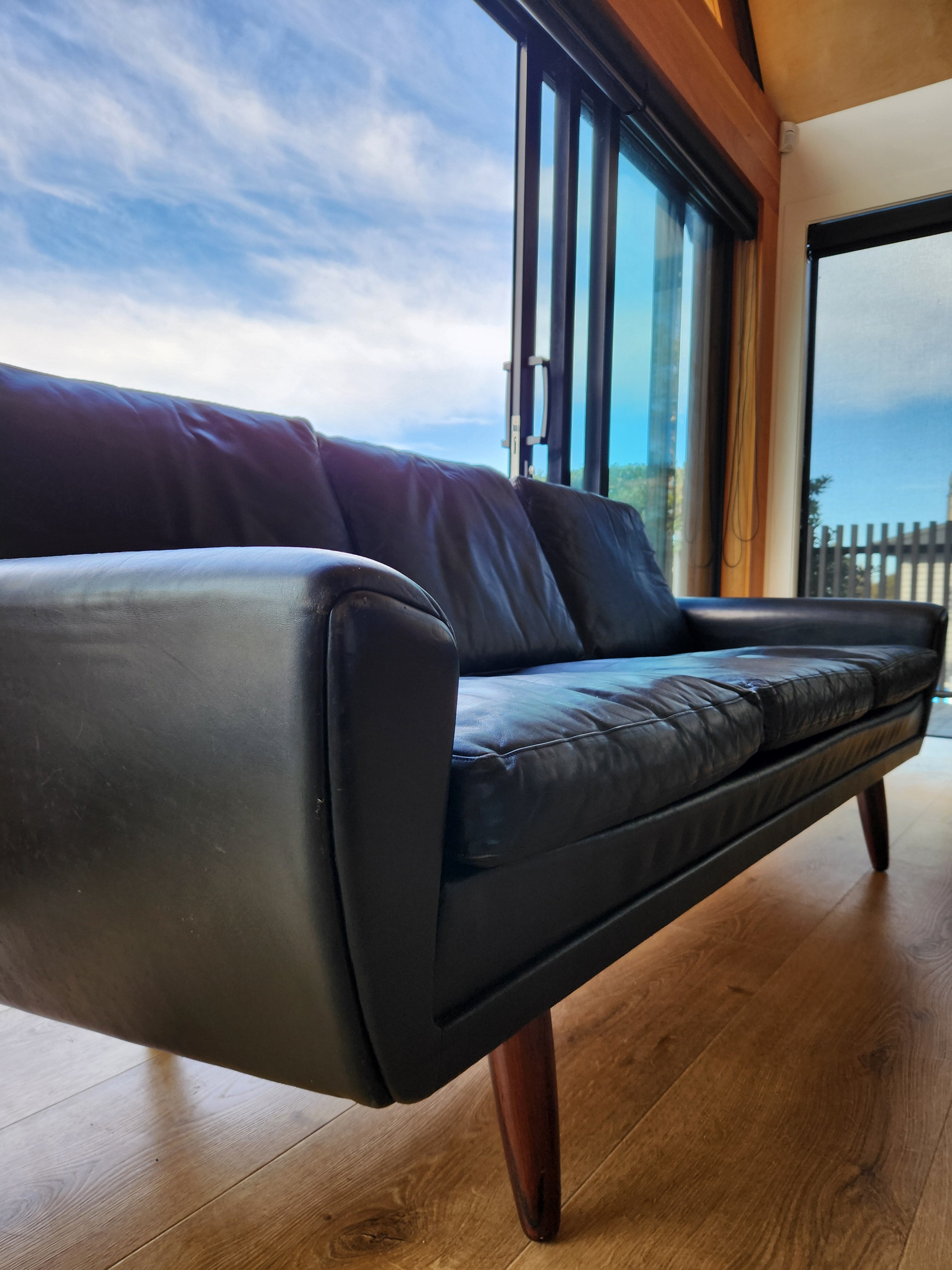 Danish mid century sofa. Close up of left end.