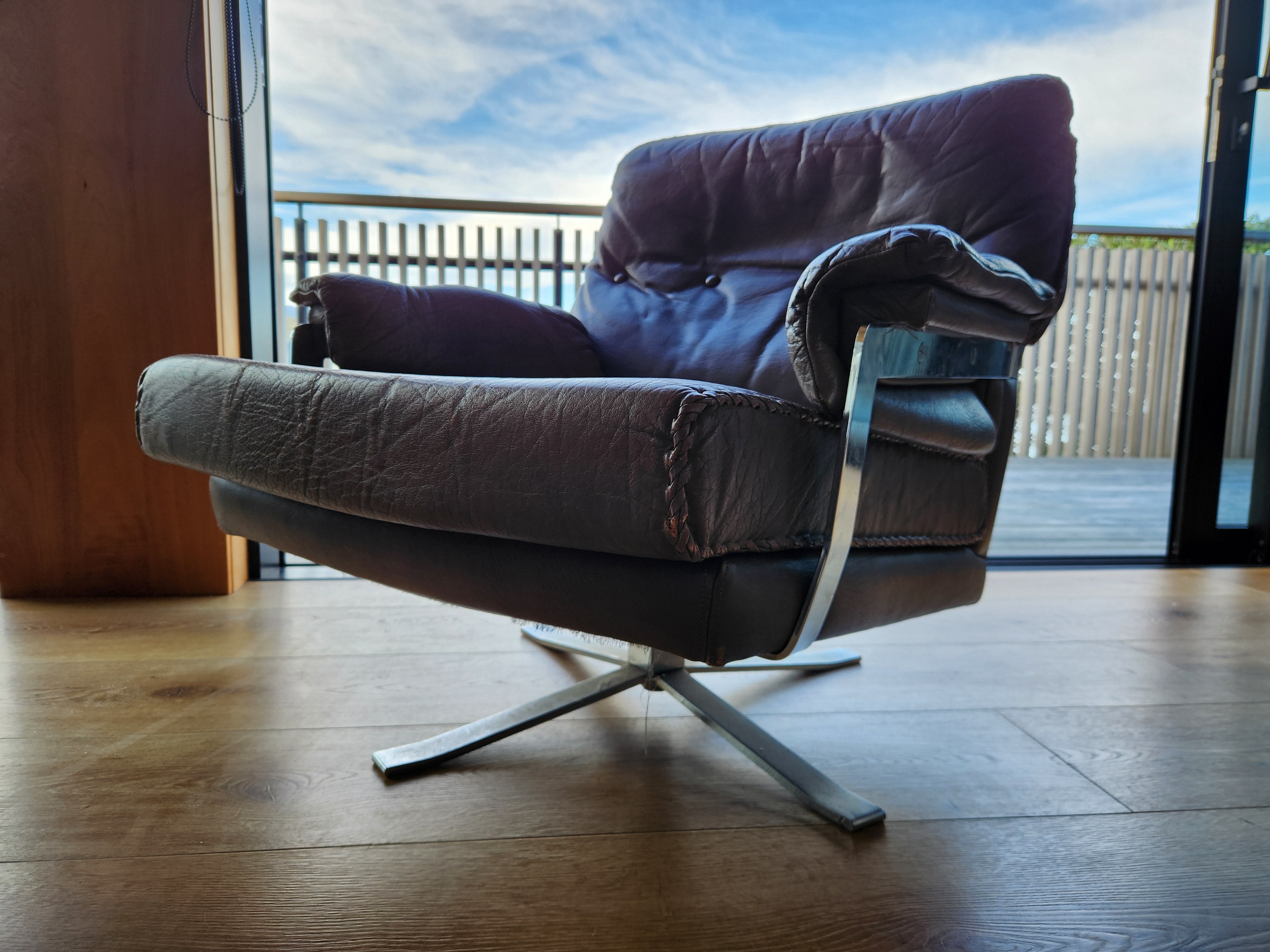 Mid Century Danish Swivel Armchair. Close up.