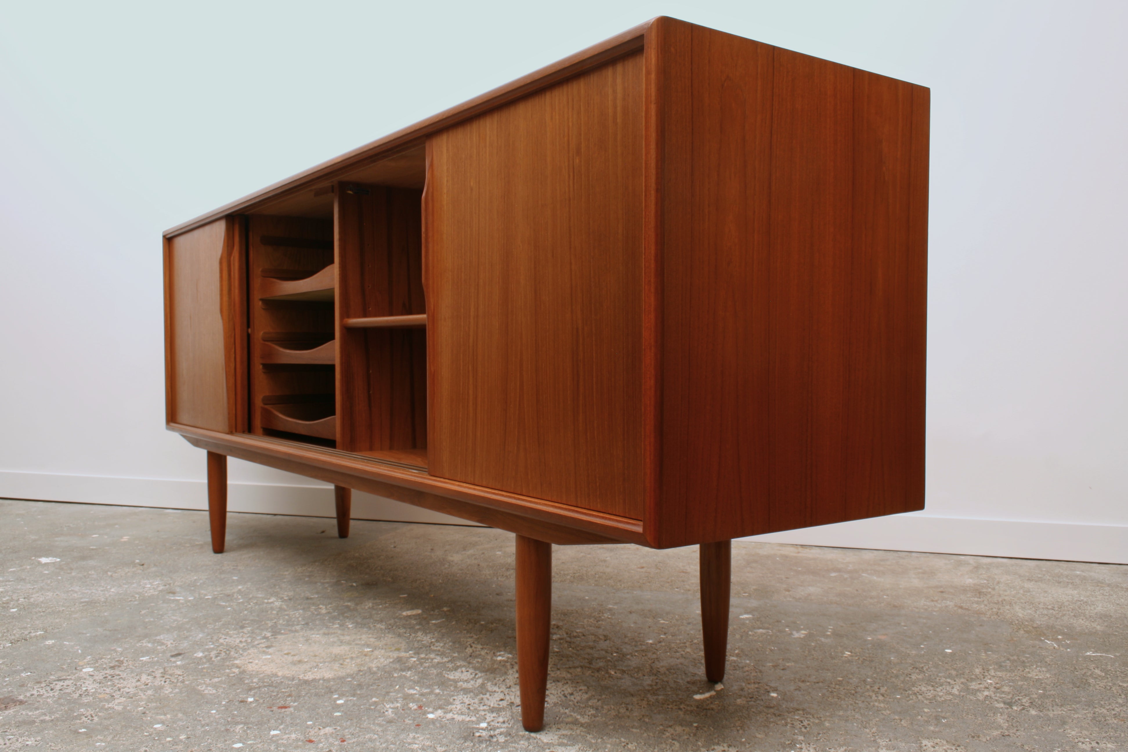 Danish Teak mid century sideboard isometric view from right corner central sliding doors open.
