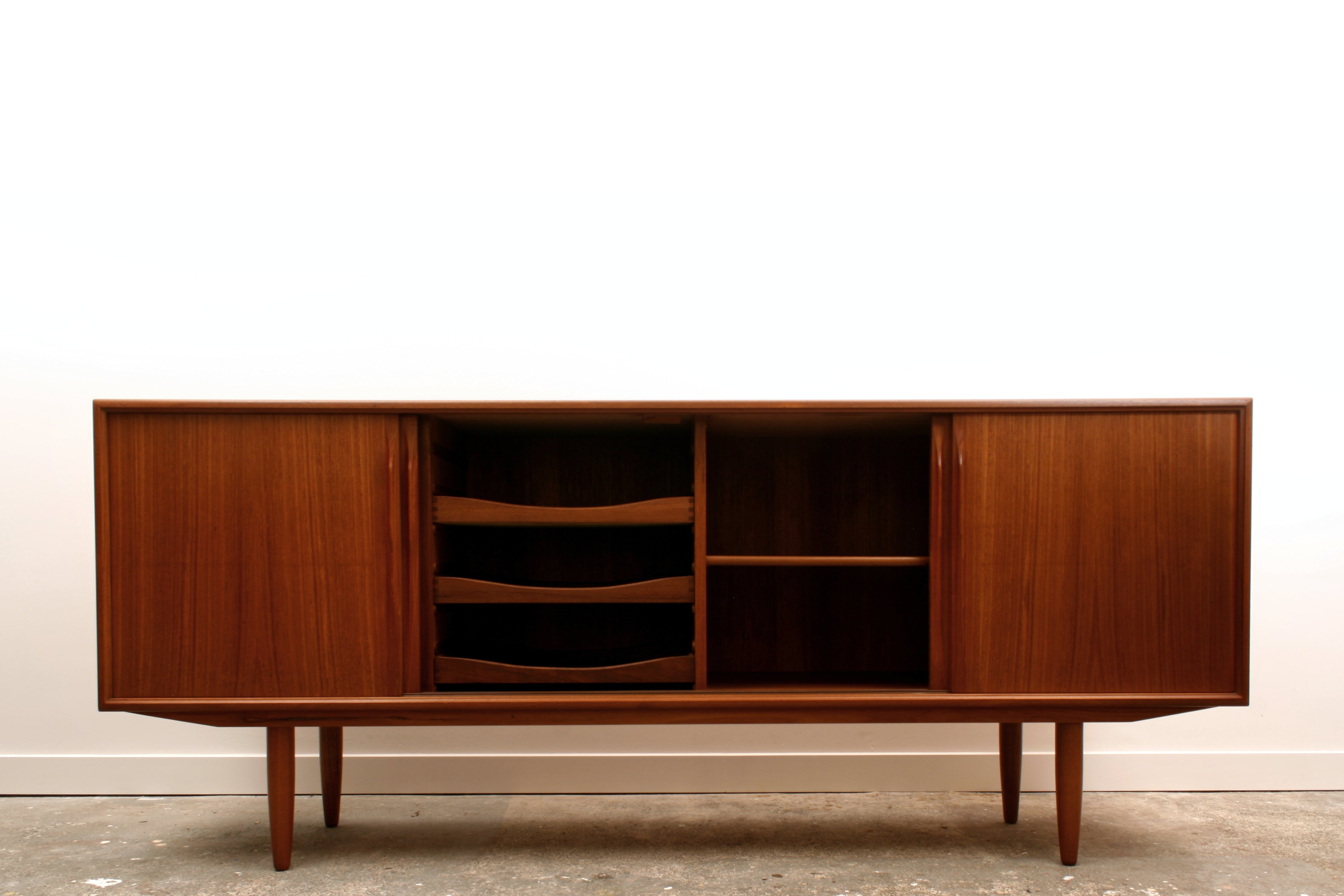 Danish Teak mid century sideboard with   inner two doors slid open.