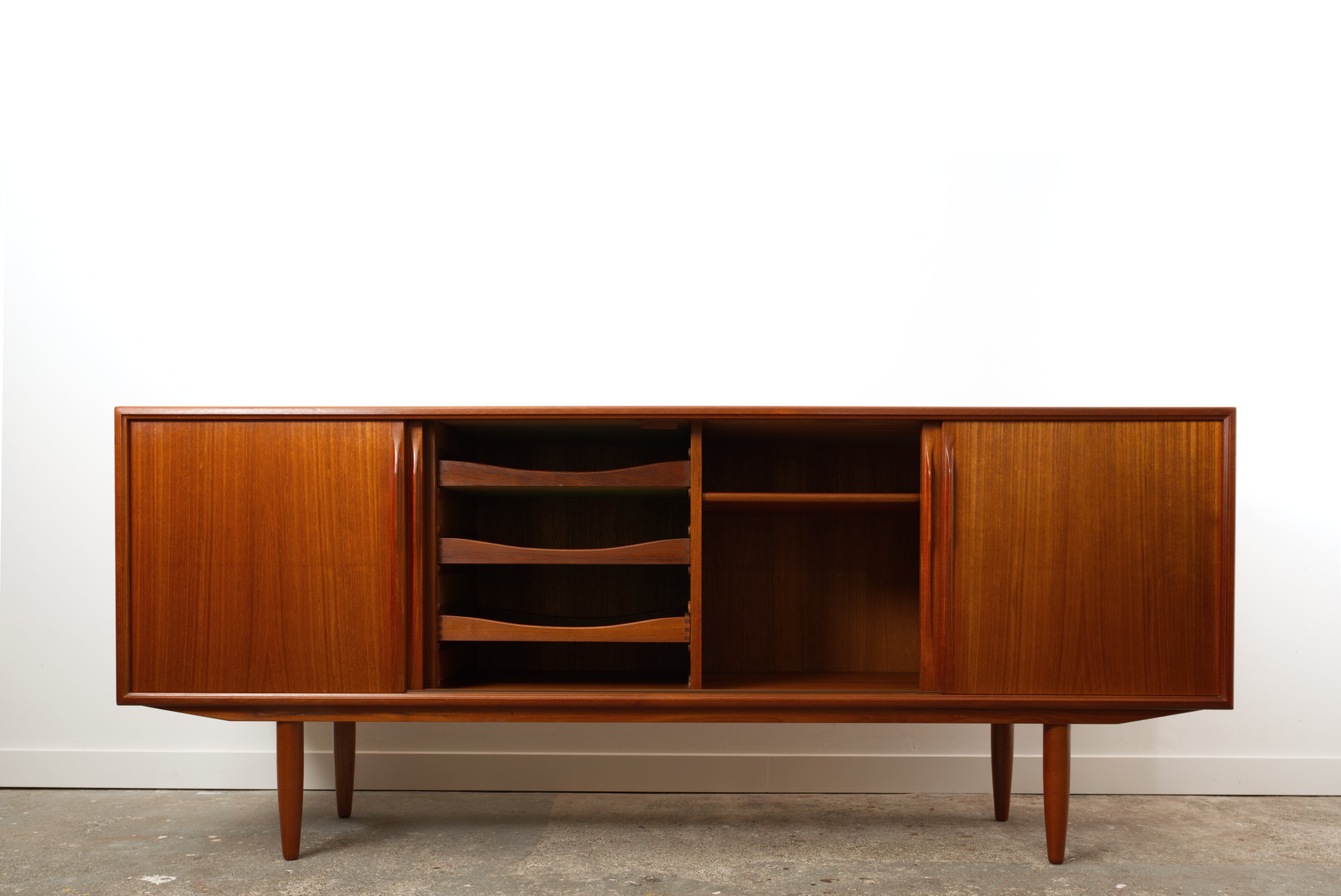 Danish Teak mid century sideboard with   inner two doors slid open.