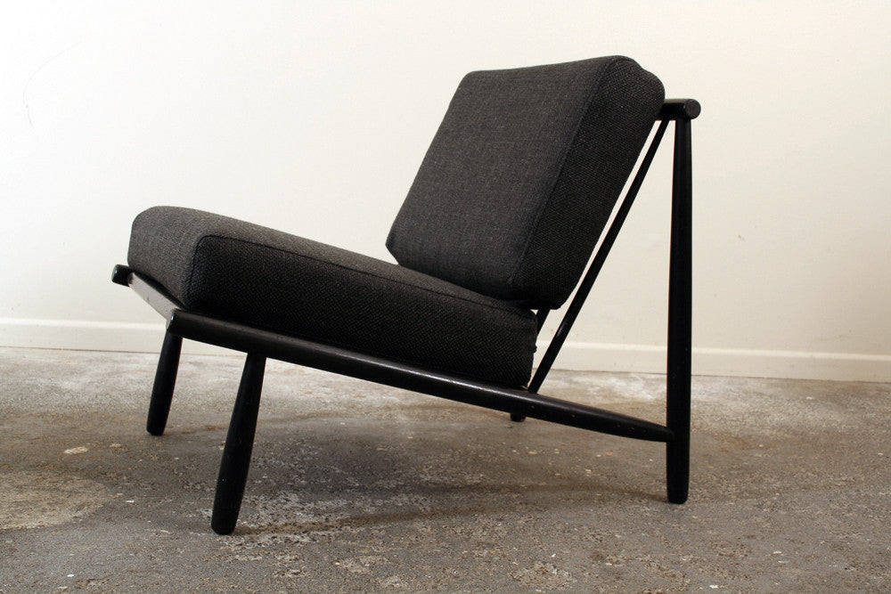 A Japanese style easy chair called the Domus one by Alf Svensson for Dux of Sweden. With a black frame and charcoal black upholstery. Made in the 1950's.