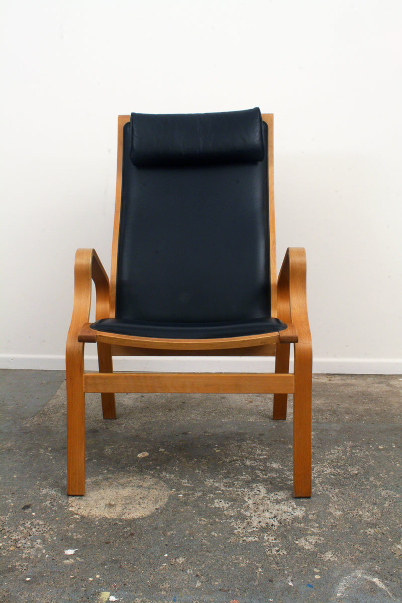 Danish Mid Century Armchair. Front view. Impeccable upholstery.