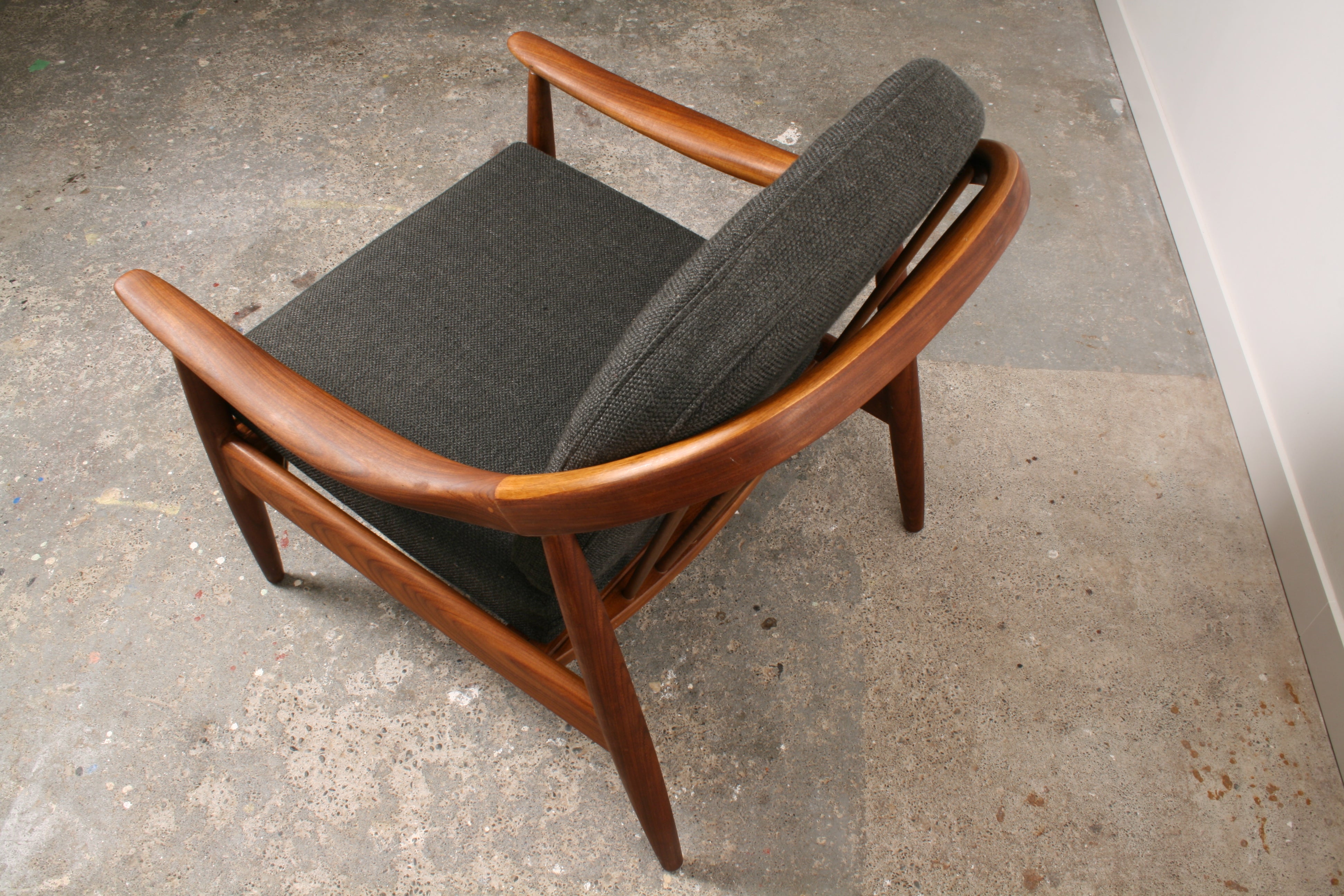 Mid Century Teak armchair close up. Solid Teak construction.