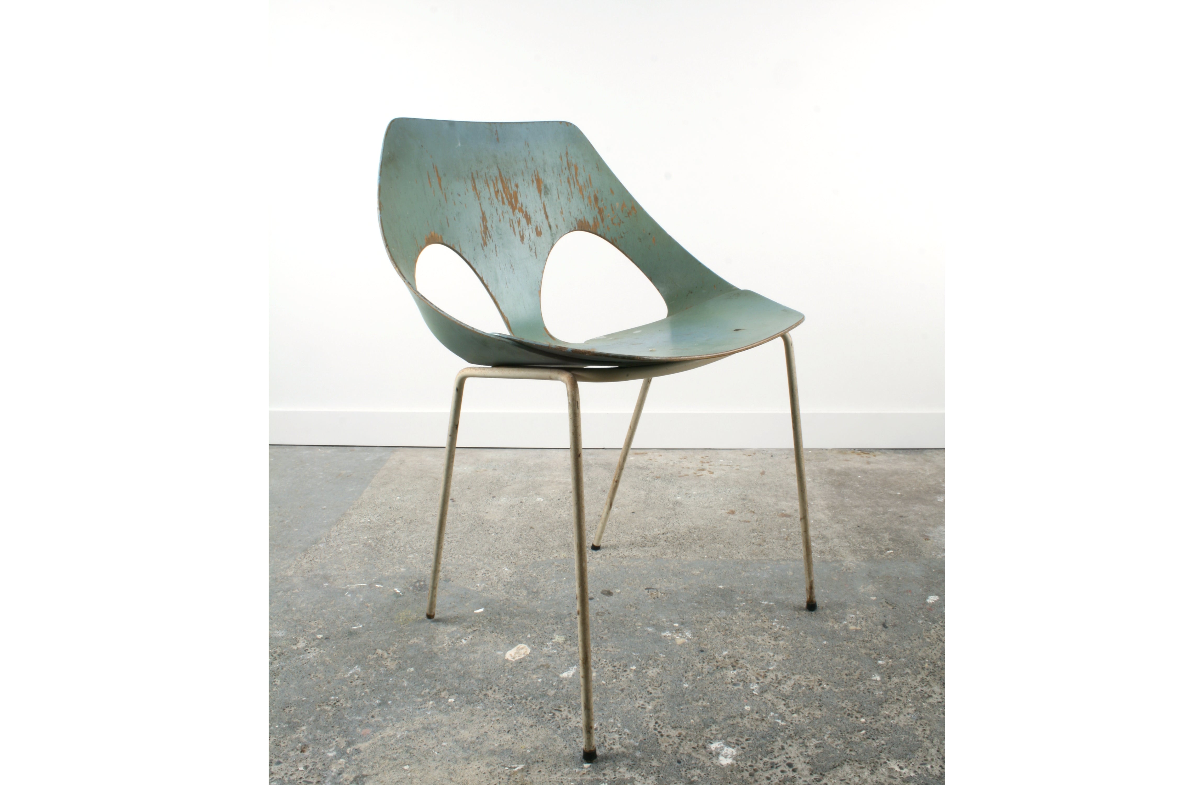 A 'Jason' chair from Kandya. A 1960's remodelled version by Frank Guille with metal legs. This show an example in rustic but structurally sound condition. With painted white legs and baby blue body made from a single piece of folded plywood.