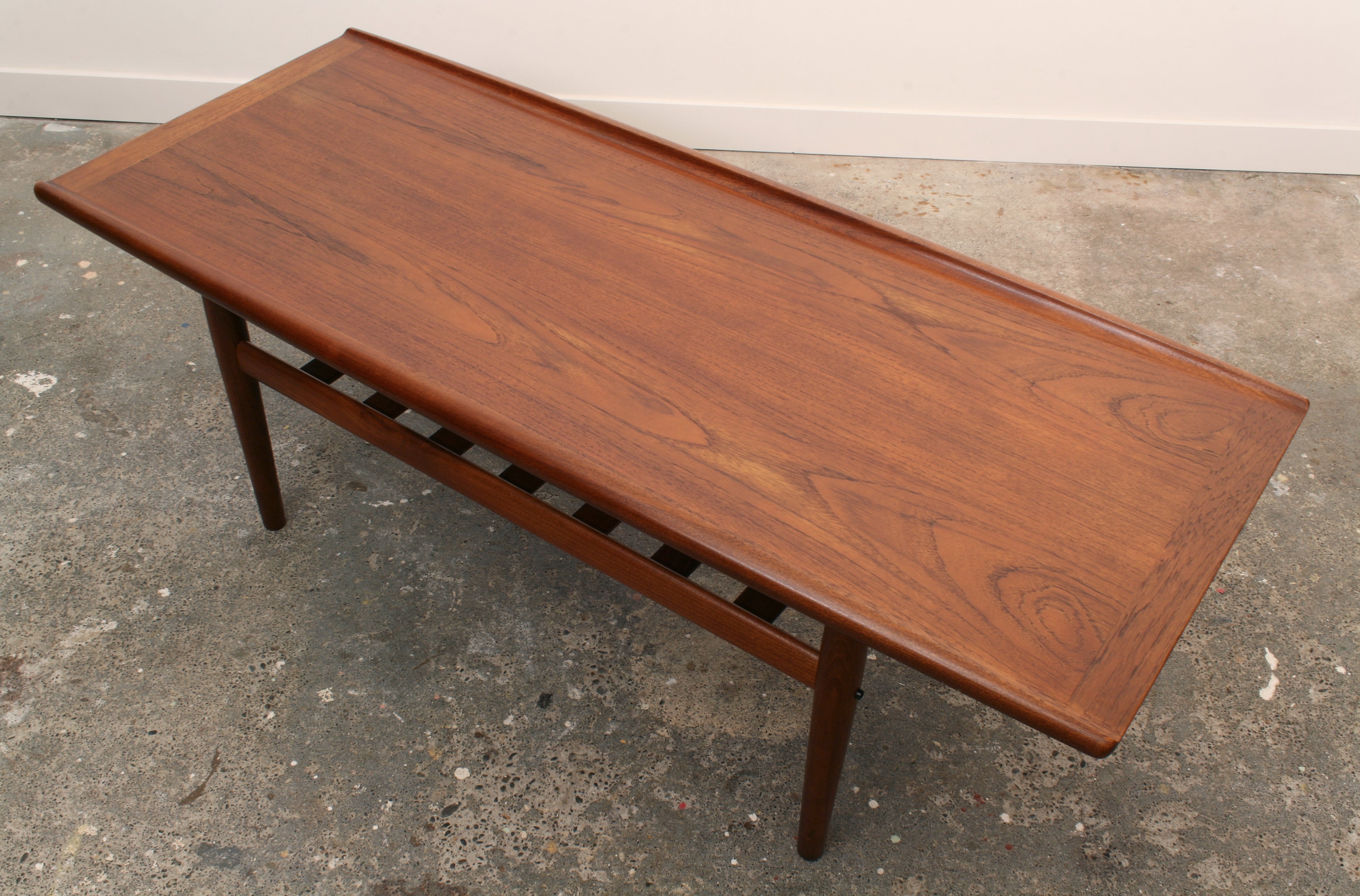 Mid Century Danish Teak Coffee Table. Top showing figurative Teak veneer.