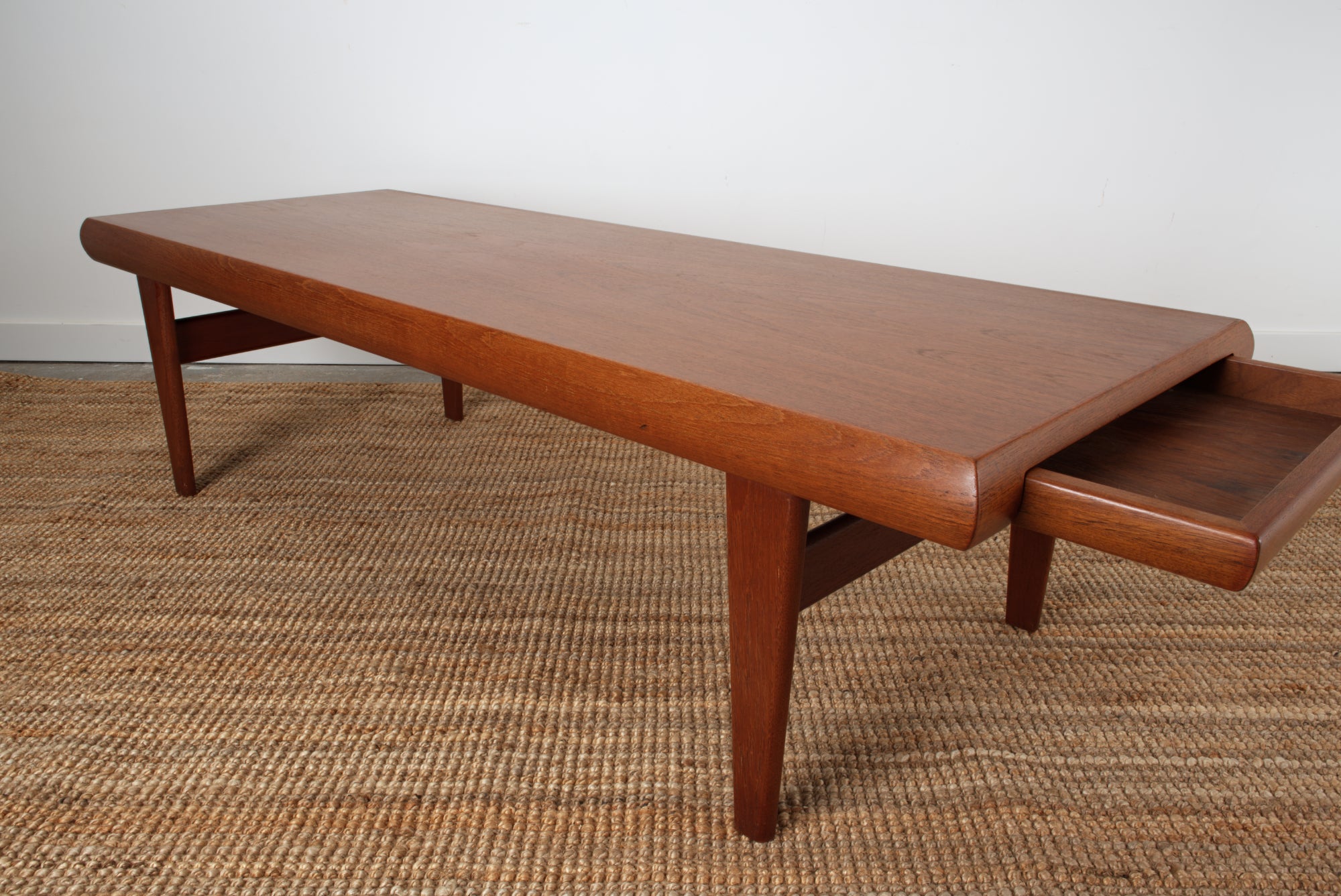 coffee table seen from above with drawer open