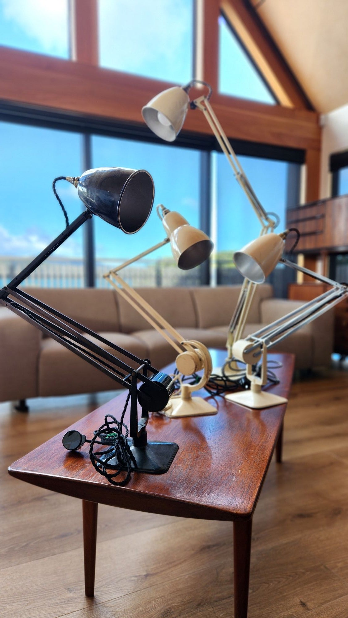 Group of old anglepoise lamps on a Hvidt coffee table.