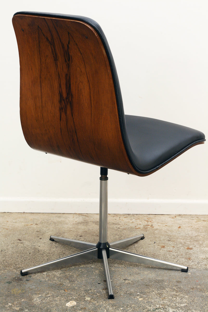 Rosewood Mid century swivel chairs showing curved structure.