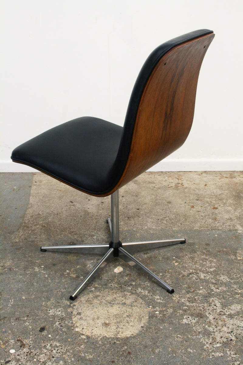 Rosewood Mid century swivel chair 2 in revolution. Showing angle of left side and back.