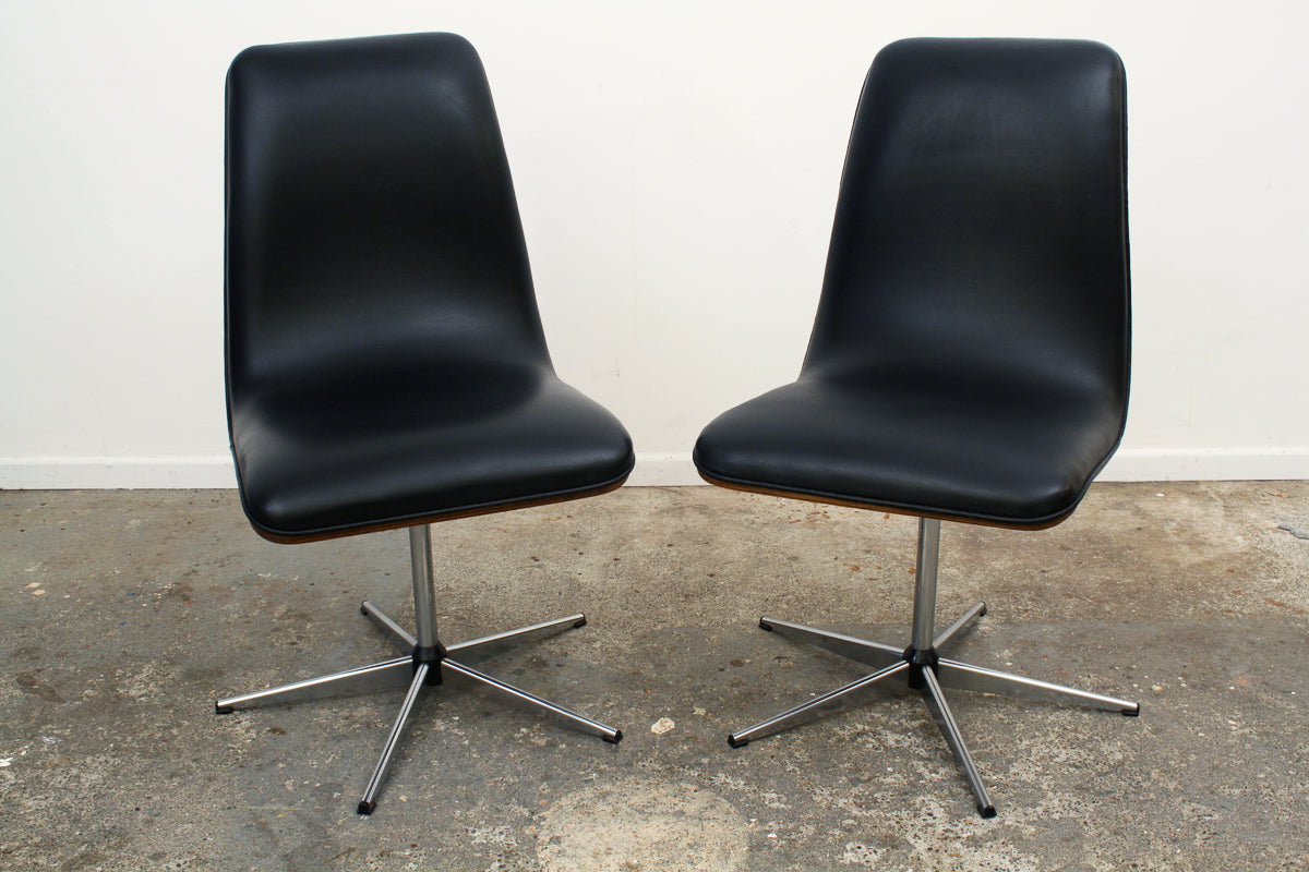 Rosewood Mid century swivel chairs. Original vinyl upholstery impeccable.