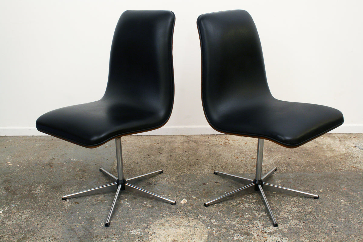 Rosewood Mid century swivel chairs. Original vinyl upholstery impeccable.