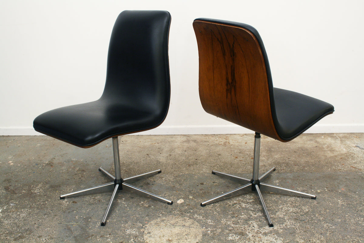 Rosewood Mid century Swivel dining chairs by Archie Shine 'Dorrington' . Highly figured Rosewood backs, black vinyl seats on five pointed star chrome bases.