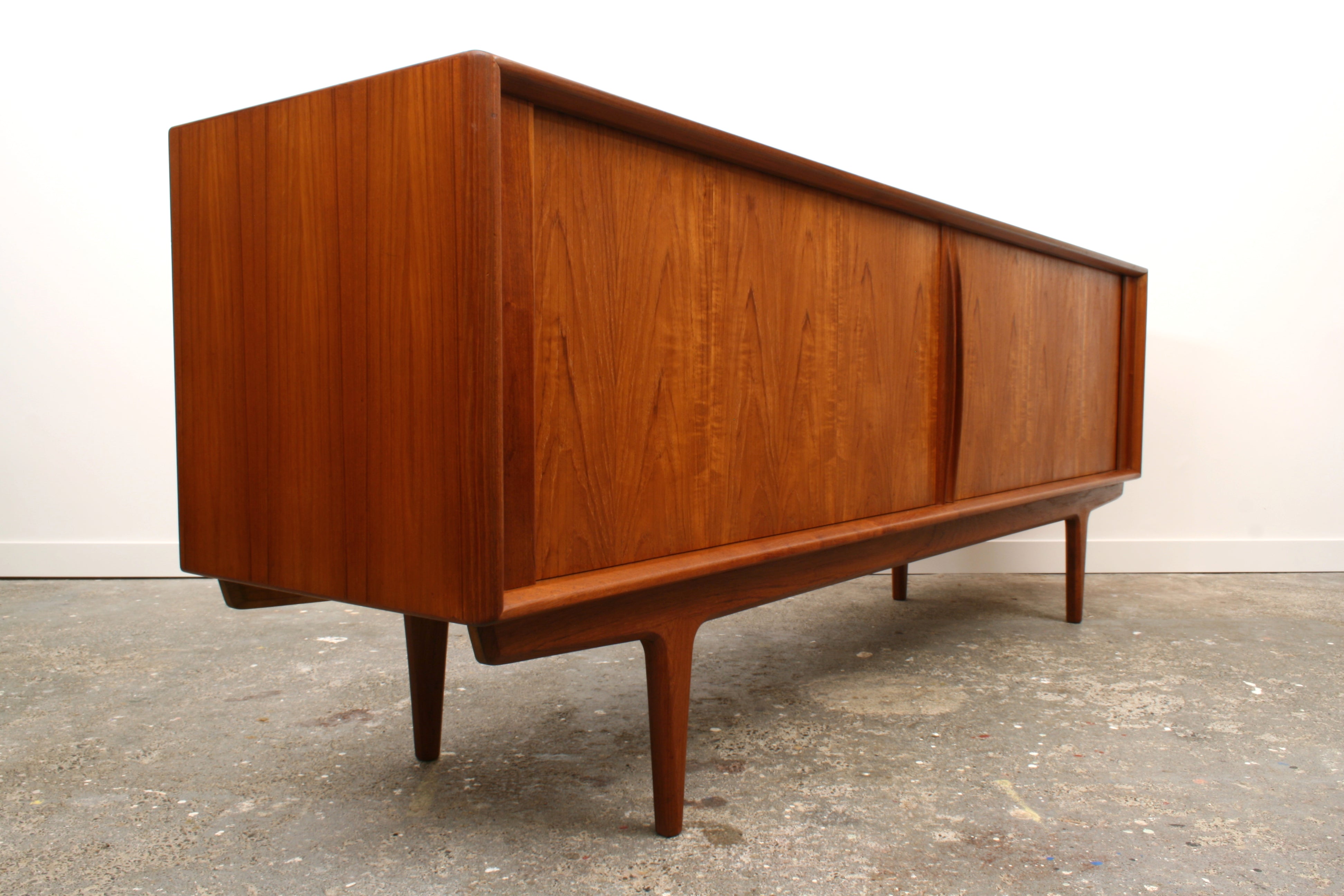 Danish Teak Tambour sideboard angled view of minimalist front.