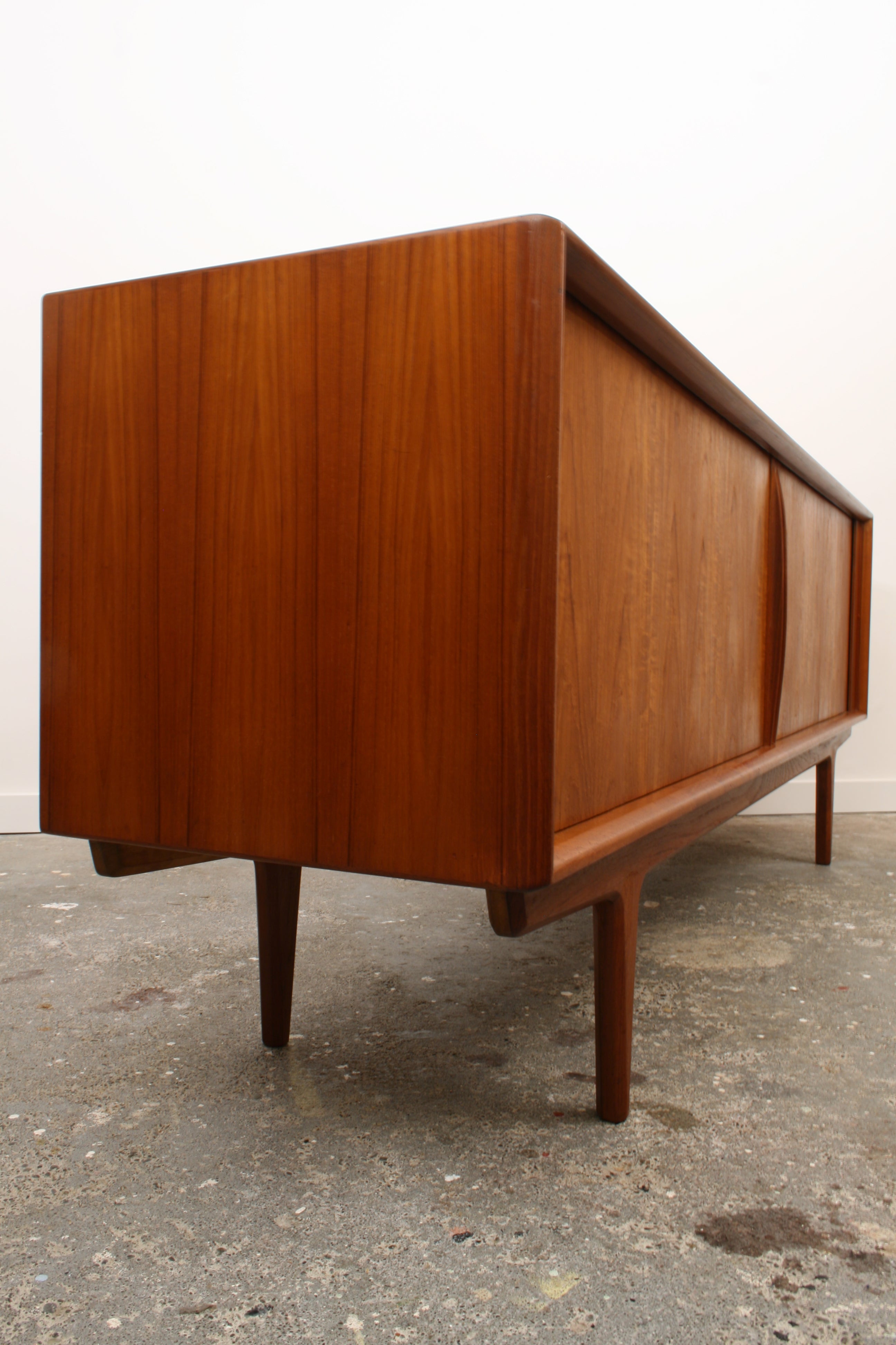 Danish Teak Tambour sideboard oblique view showing end panels straight teak grain.