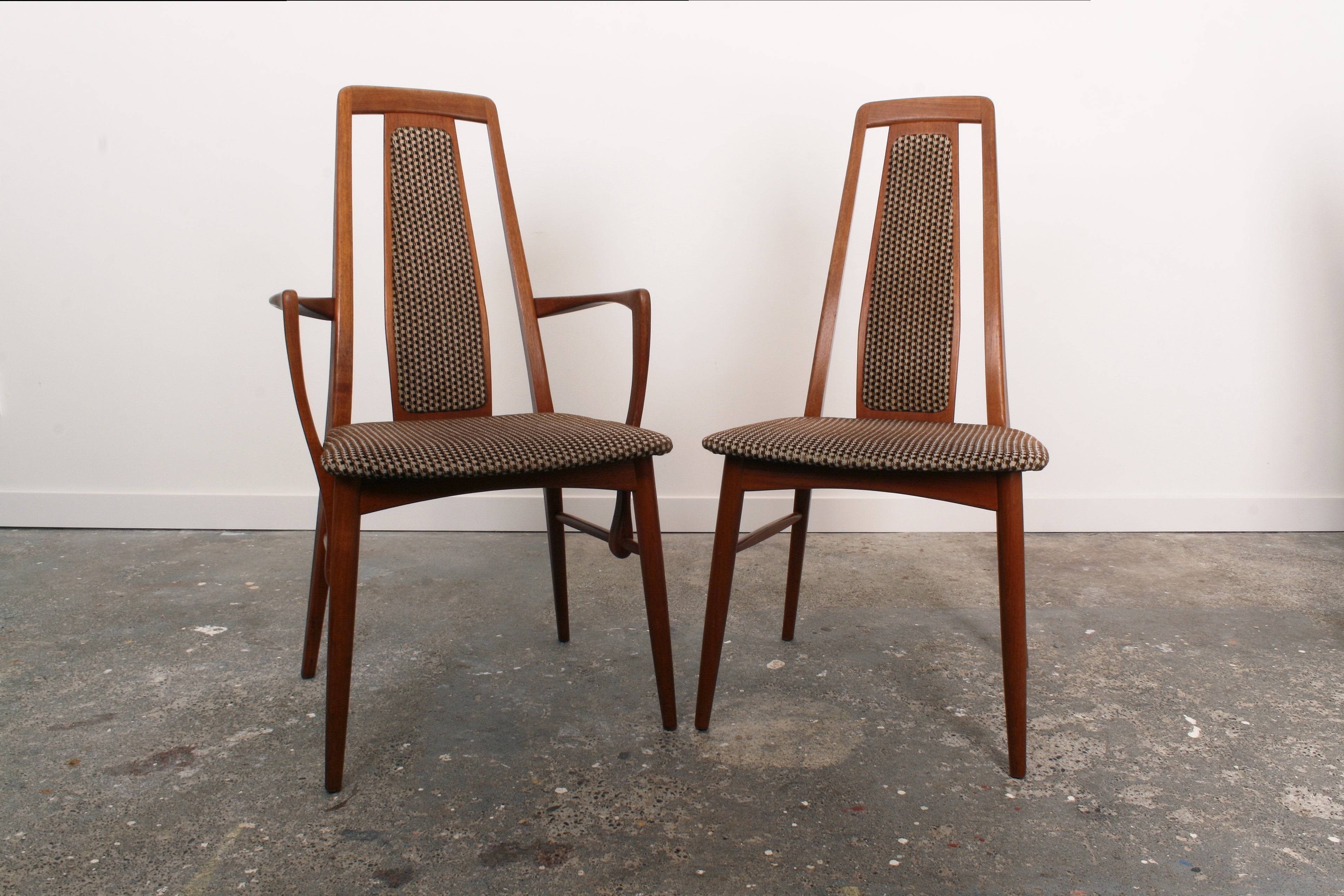 A Danish mid century teak carvers and chair.