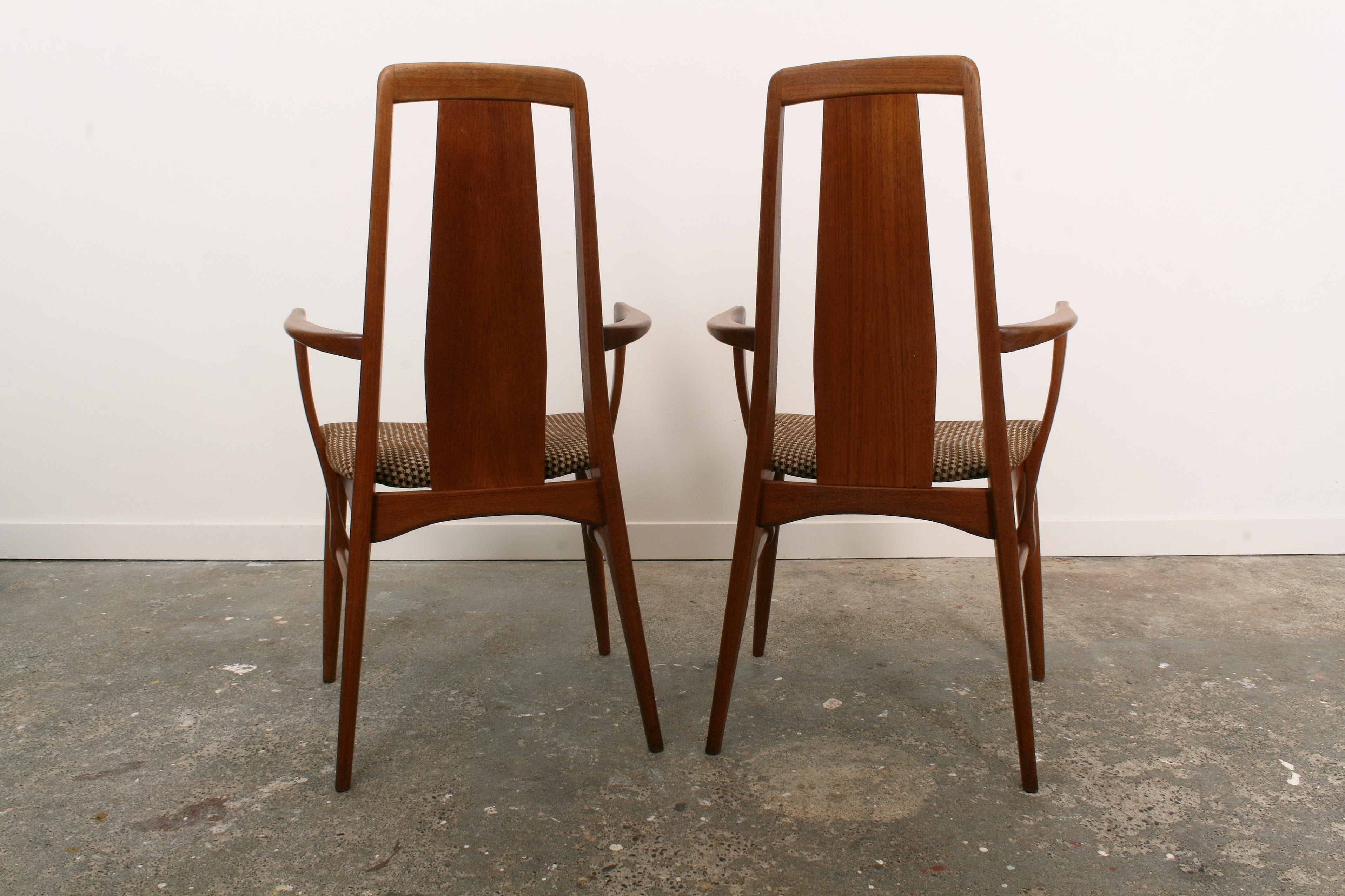 Danish mid century teak carvers shown from rear.