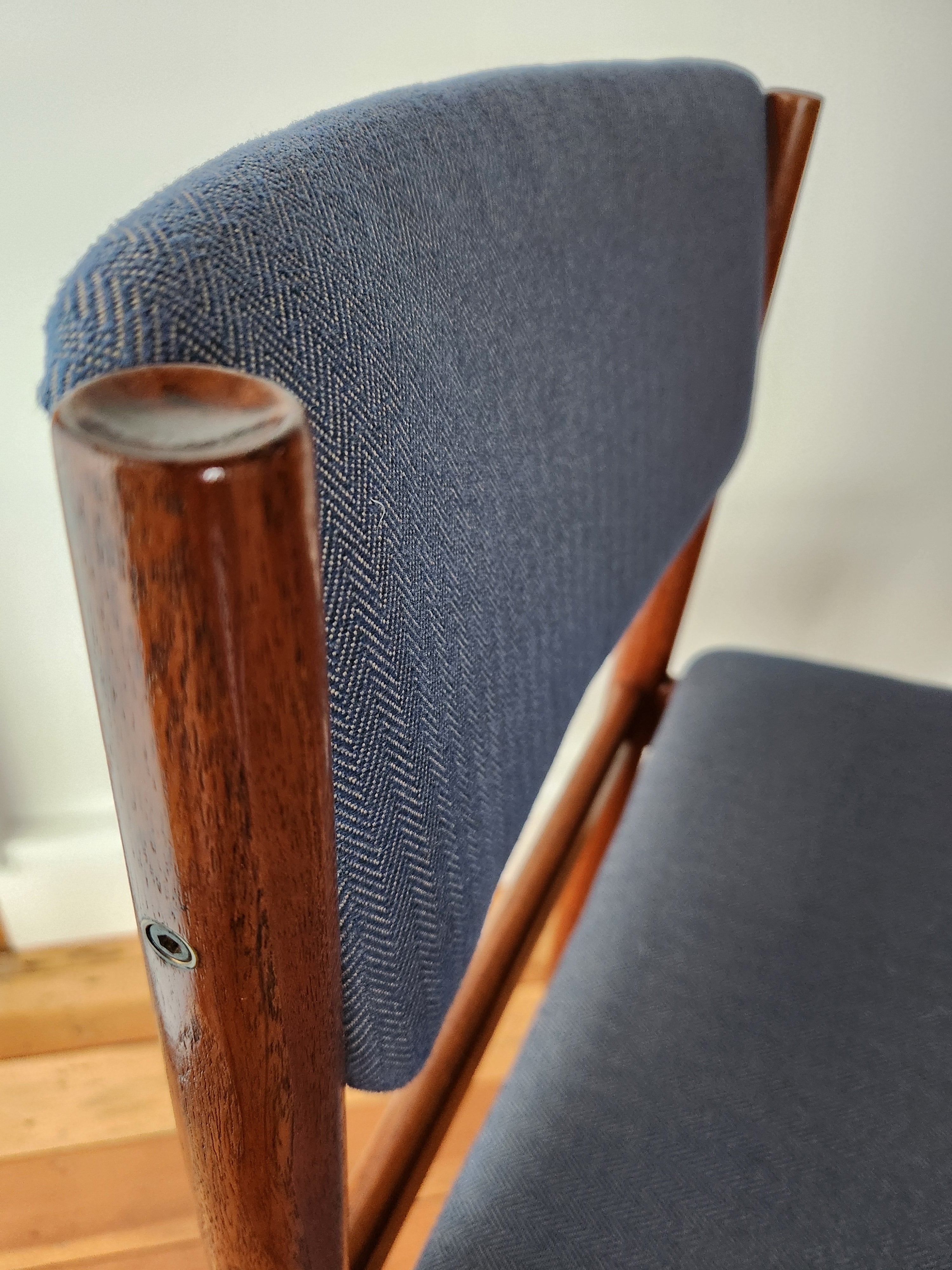 Danish modern dining chair showing japan series sculpting to rear leg.