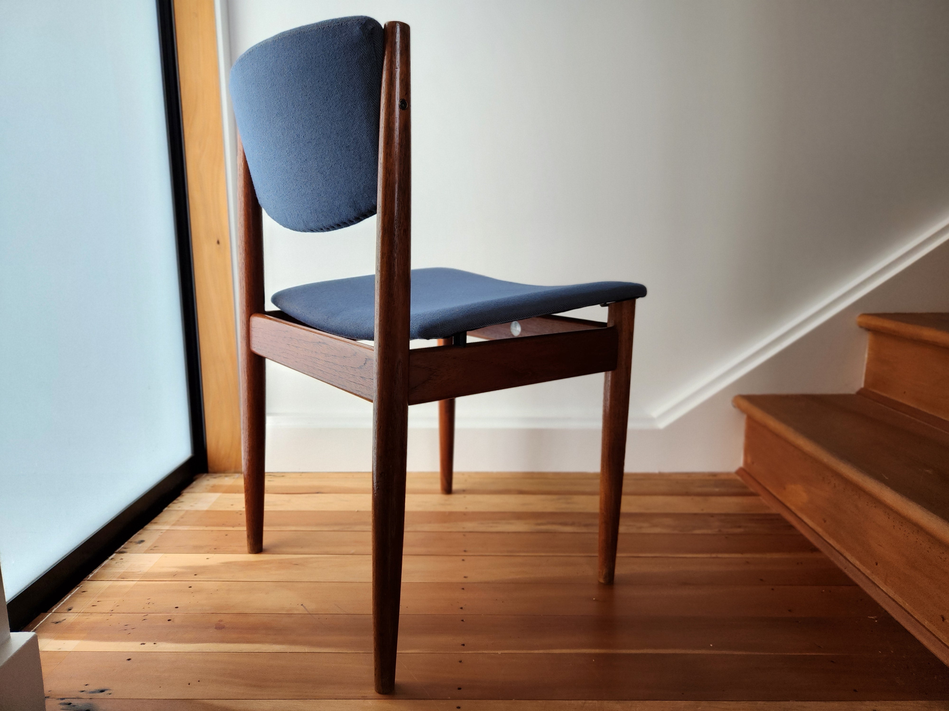 Danish modern dining chairs. Showing tapered, cigar like back leg.