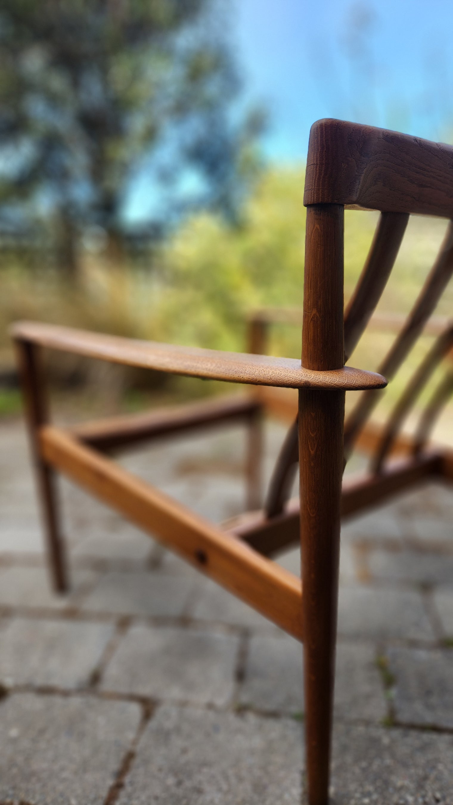 Grete Jalk PJ56 armchair in Oak. Close up of arm and rear leg distinctive through join.