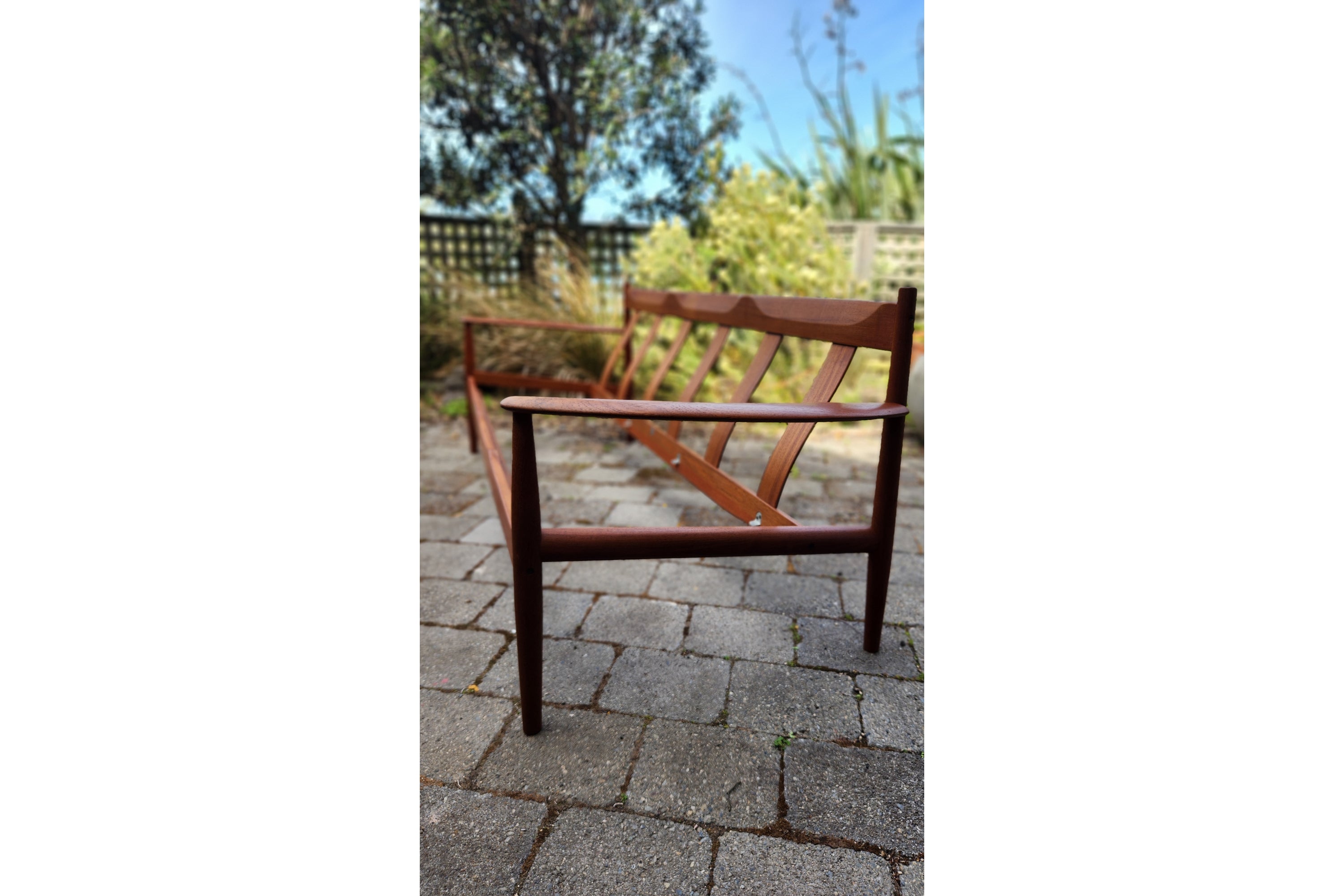 Gete Jalk model 118 sofa in Teak shown without cushions showing back detailing.