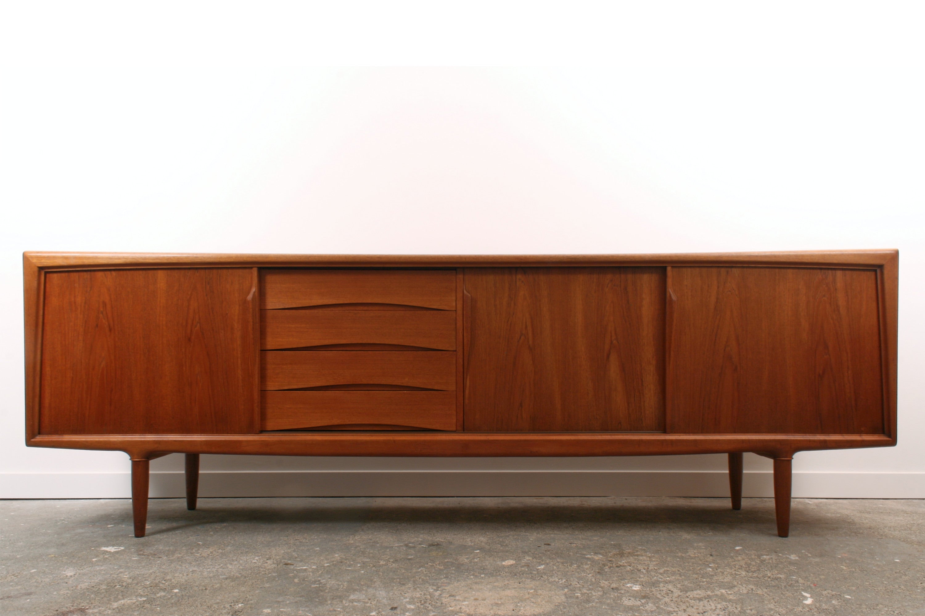 Teak Danish sideboard by Gunni Omann. Seen from the front.