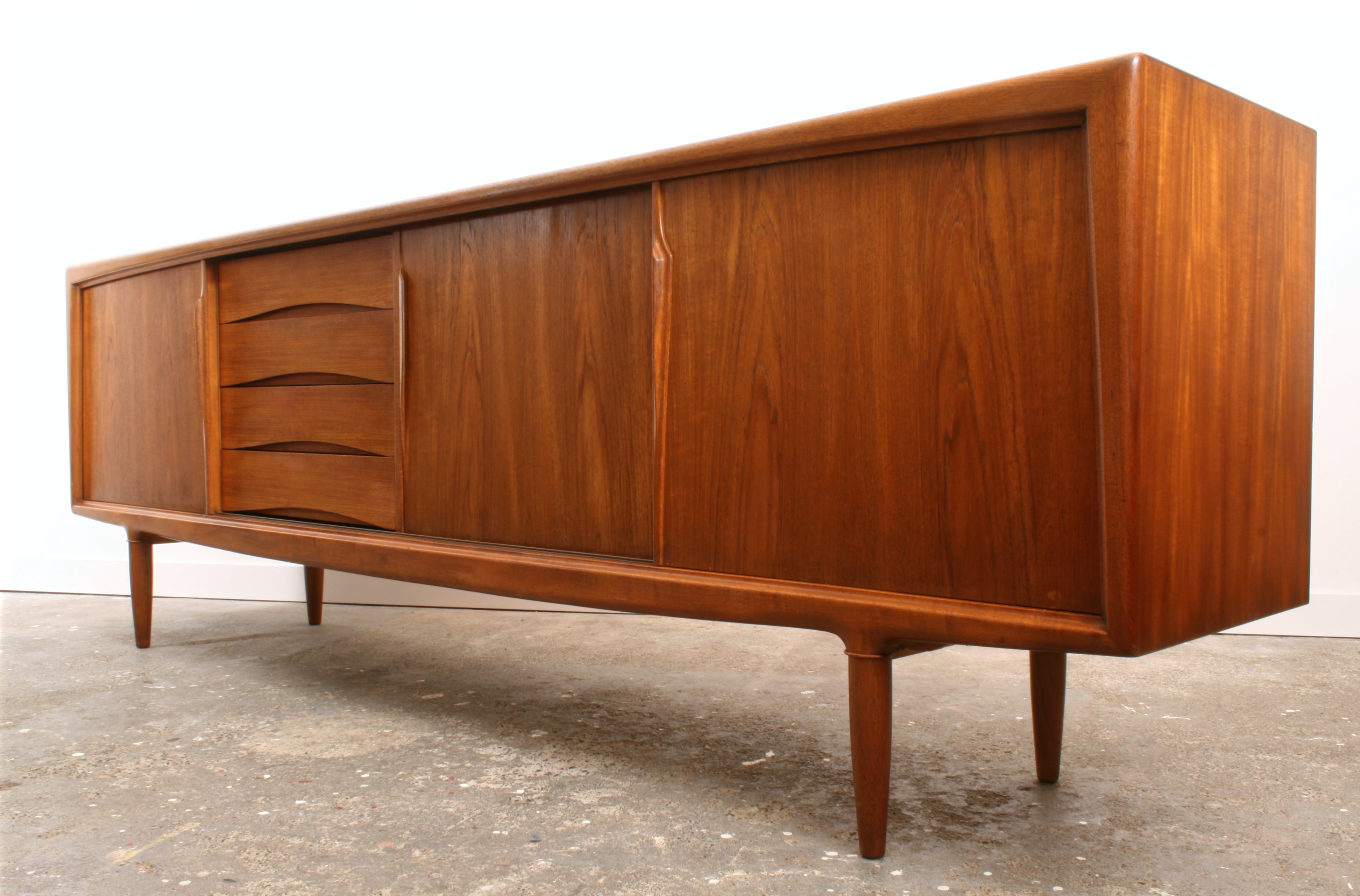 Large Danish teak sideboard by Gunni Oman for Oman showing its sculptural presence.