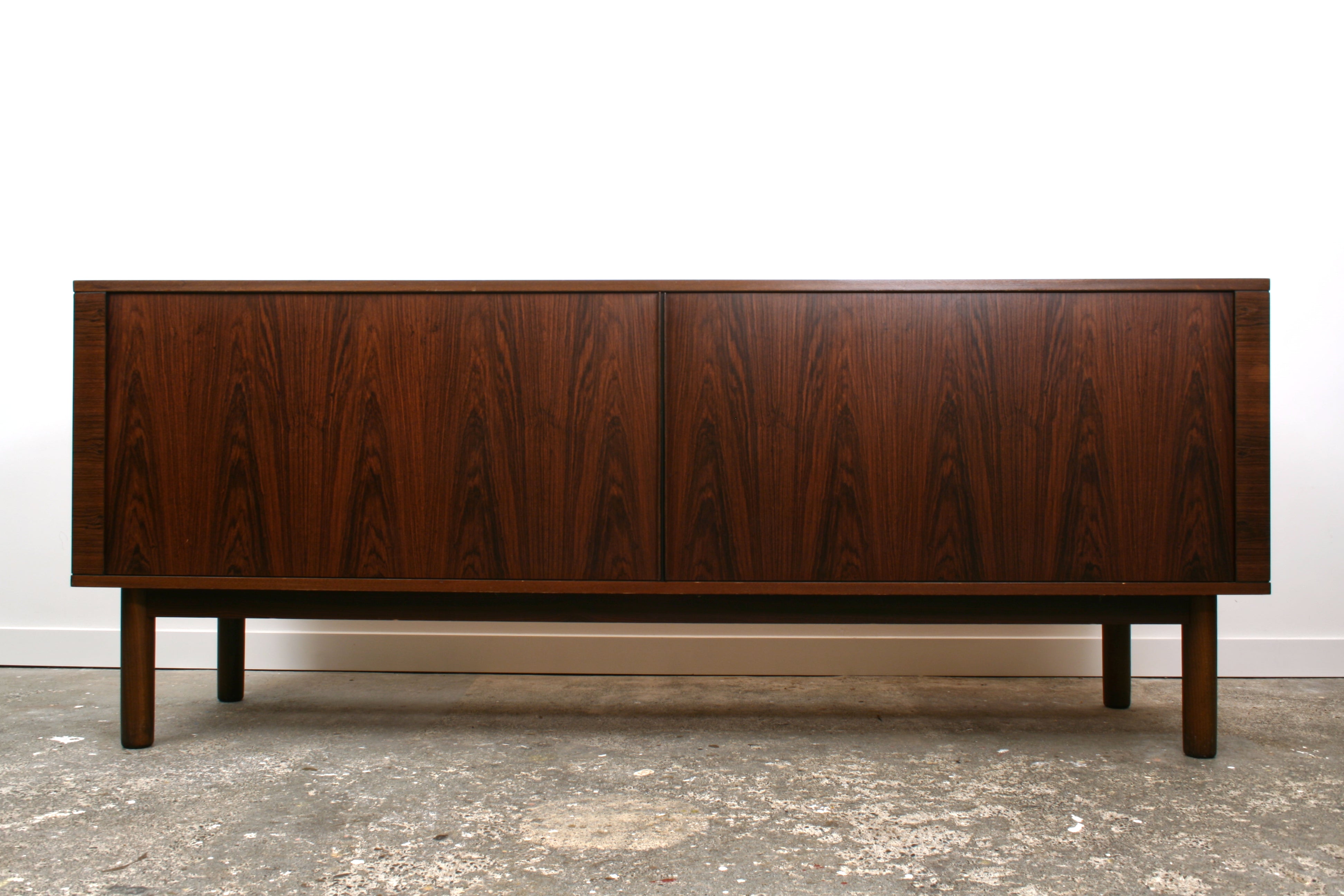 Danish Tambour sideboard by Hornslet Mobelfabrik. With doors closed detailing the bookmatched Rosewood veneers. 