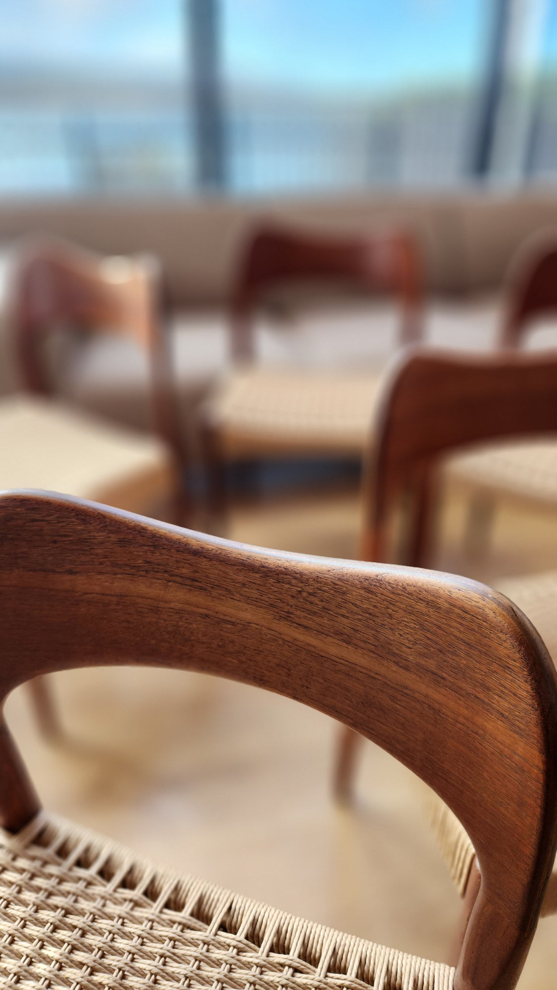 A set of eight Arne Hovmand-Olsen chairs by Mogens Kold (five shown). With newly weaved Danish cord. Close-up.