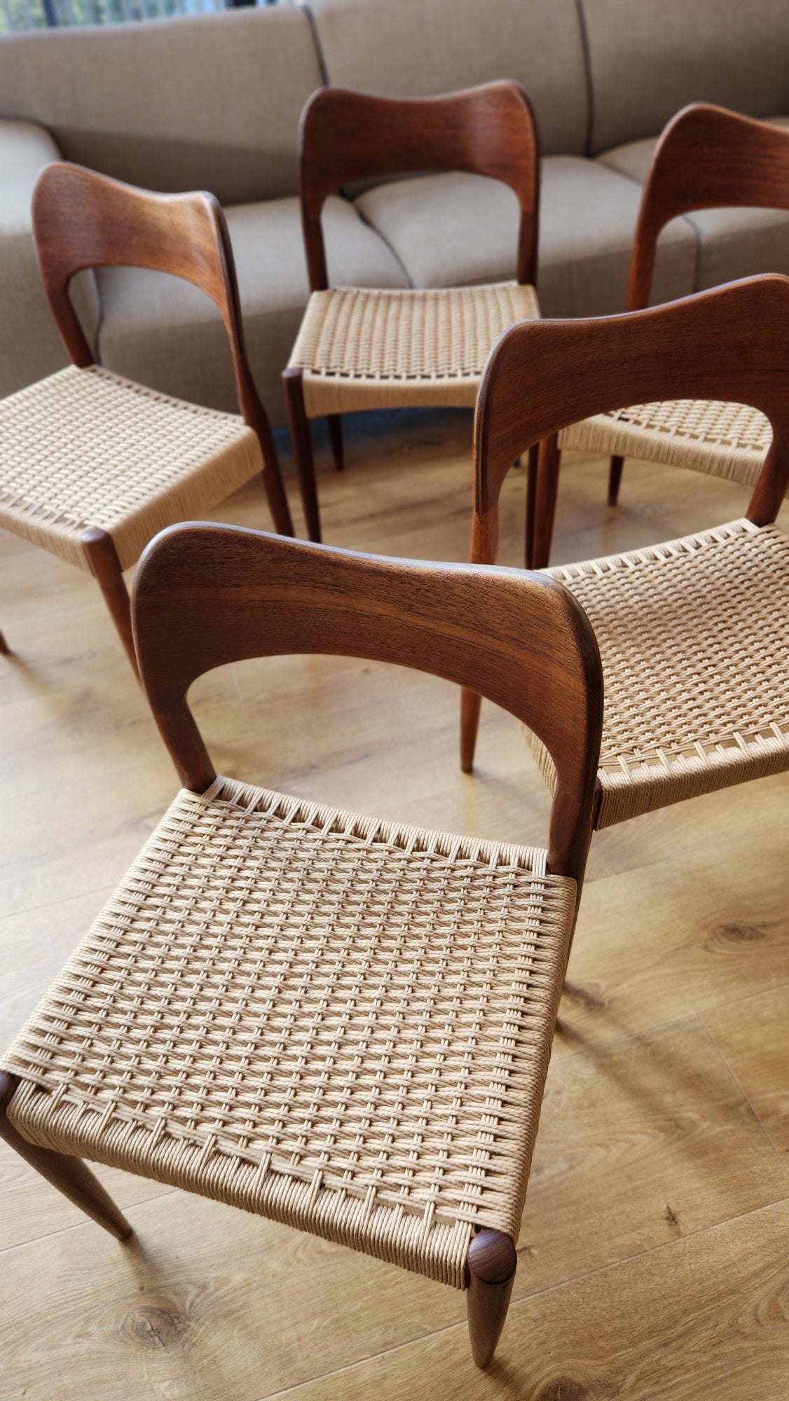 A set of eight Arne Hovmand-Olsen chairs by Mogens Kold (five shown). With newly weaved Danish cord. From above.