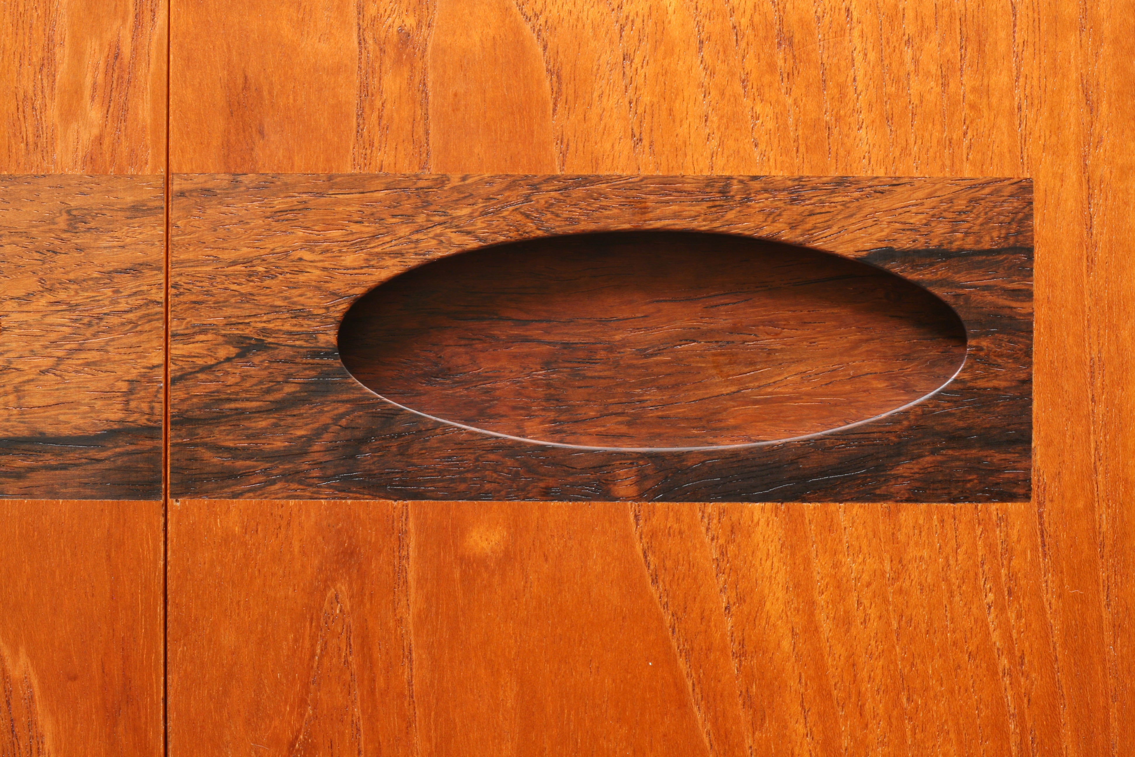 Mid Century sideboard close up of rosewood door pull.