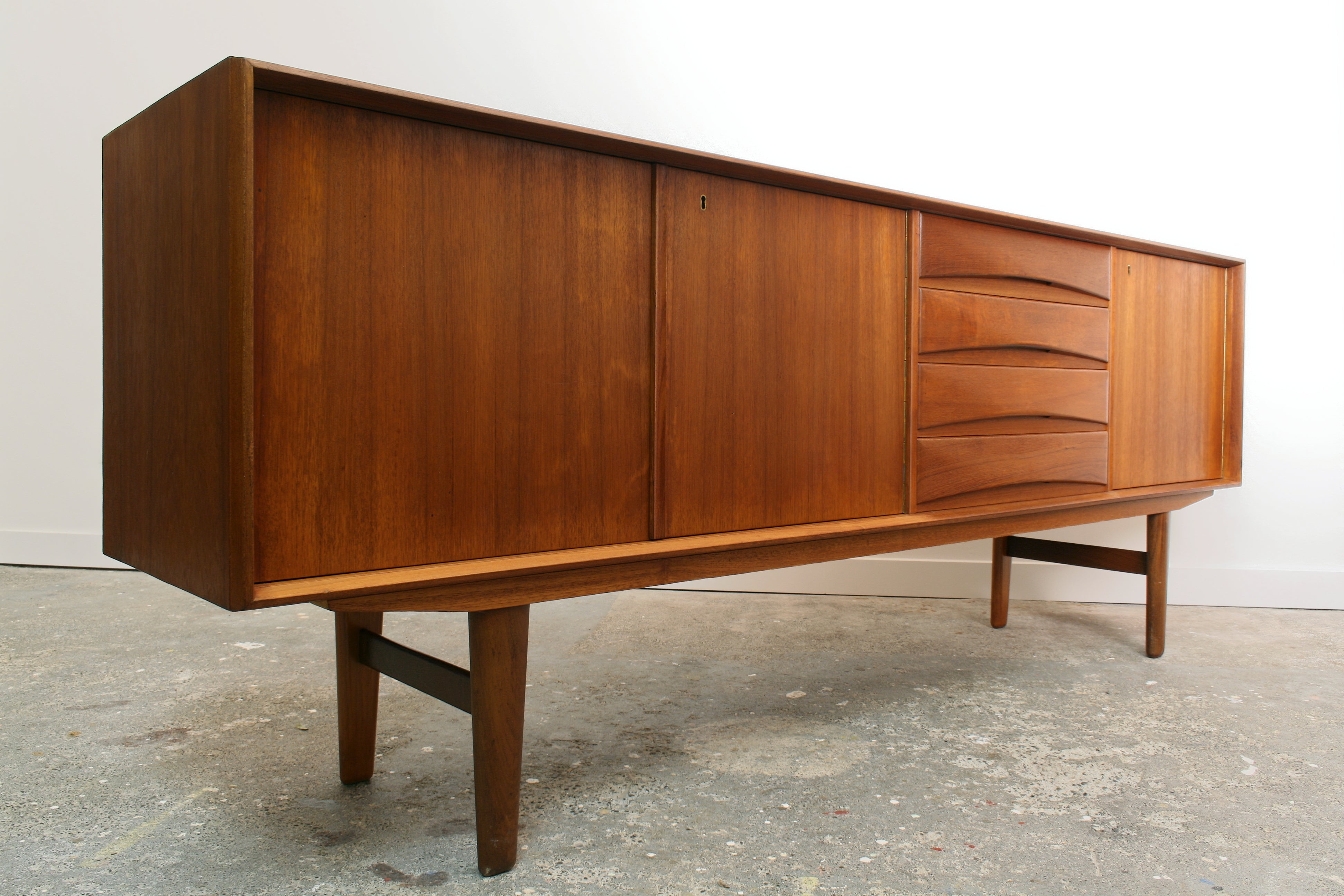 Norwegian teak sideboard in isometric view from left front.