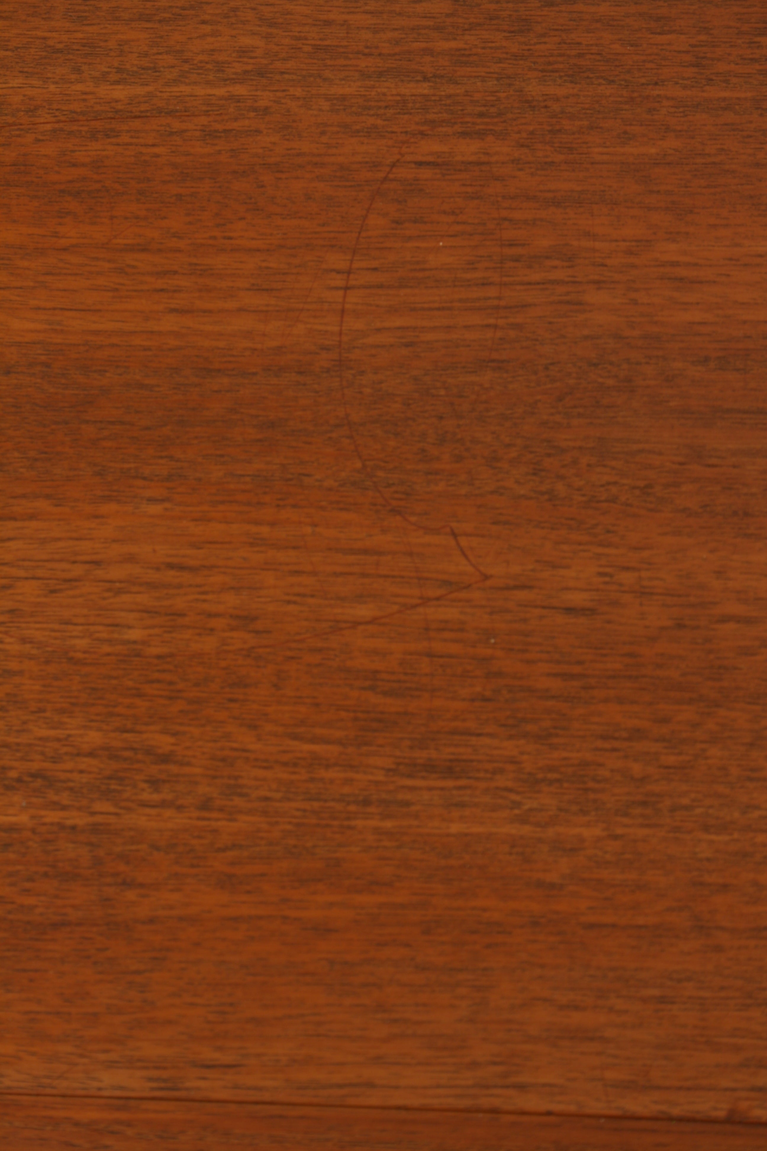 Norwegian teak sideboard close up of top showing faint light marking.