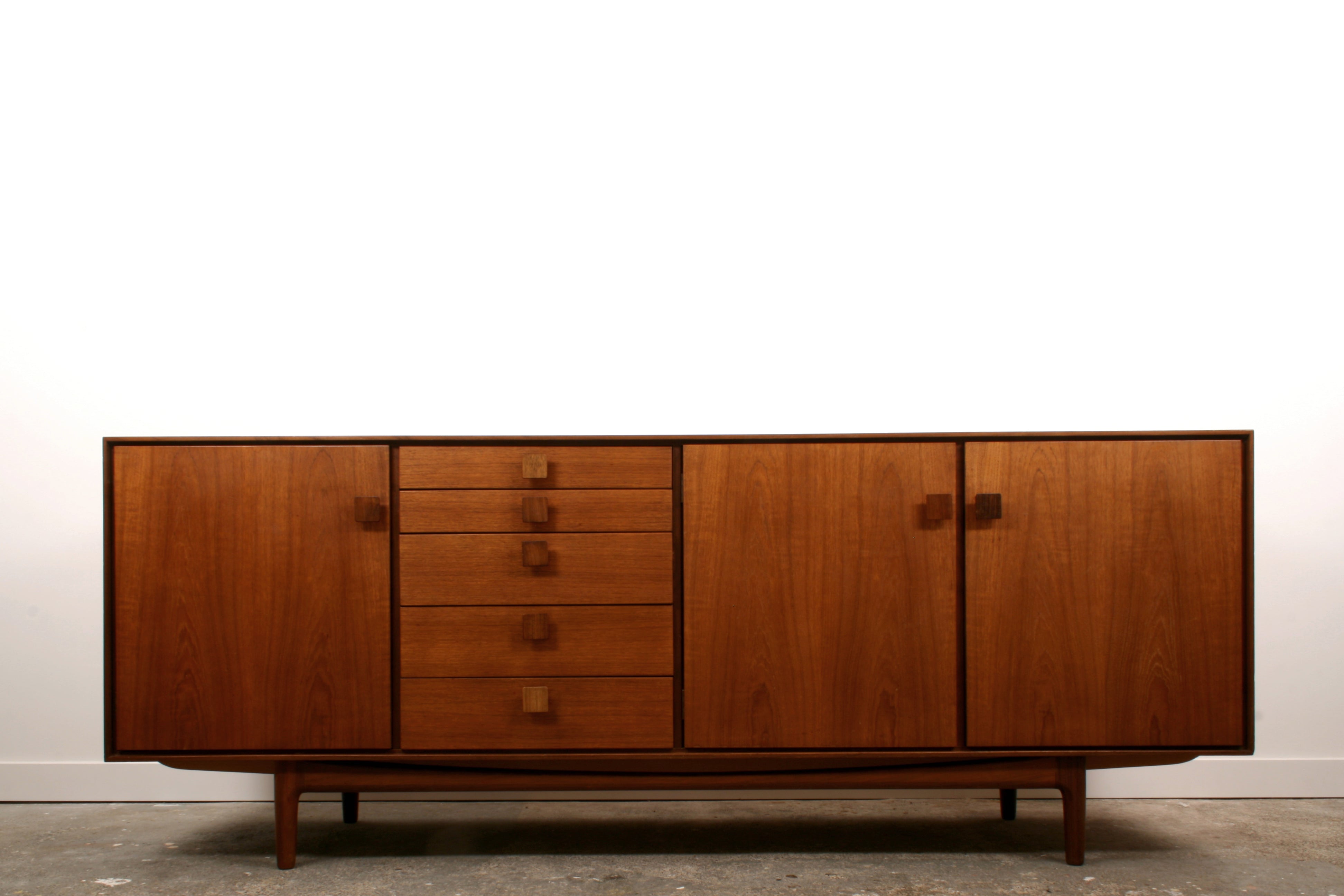 Ib Kofod Larsen Mid Century teak sideboard by G plan highlighting the figurative teak veneer. 