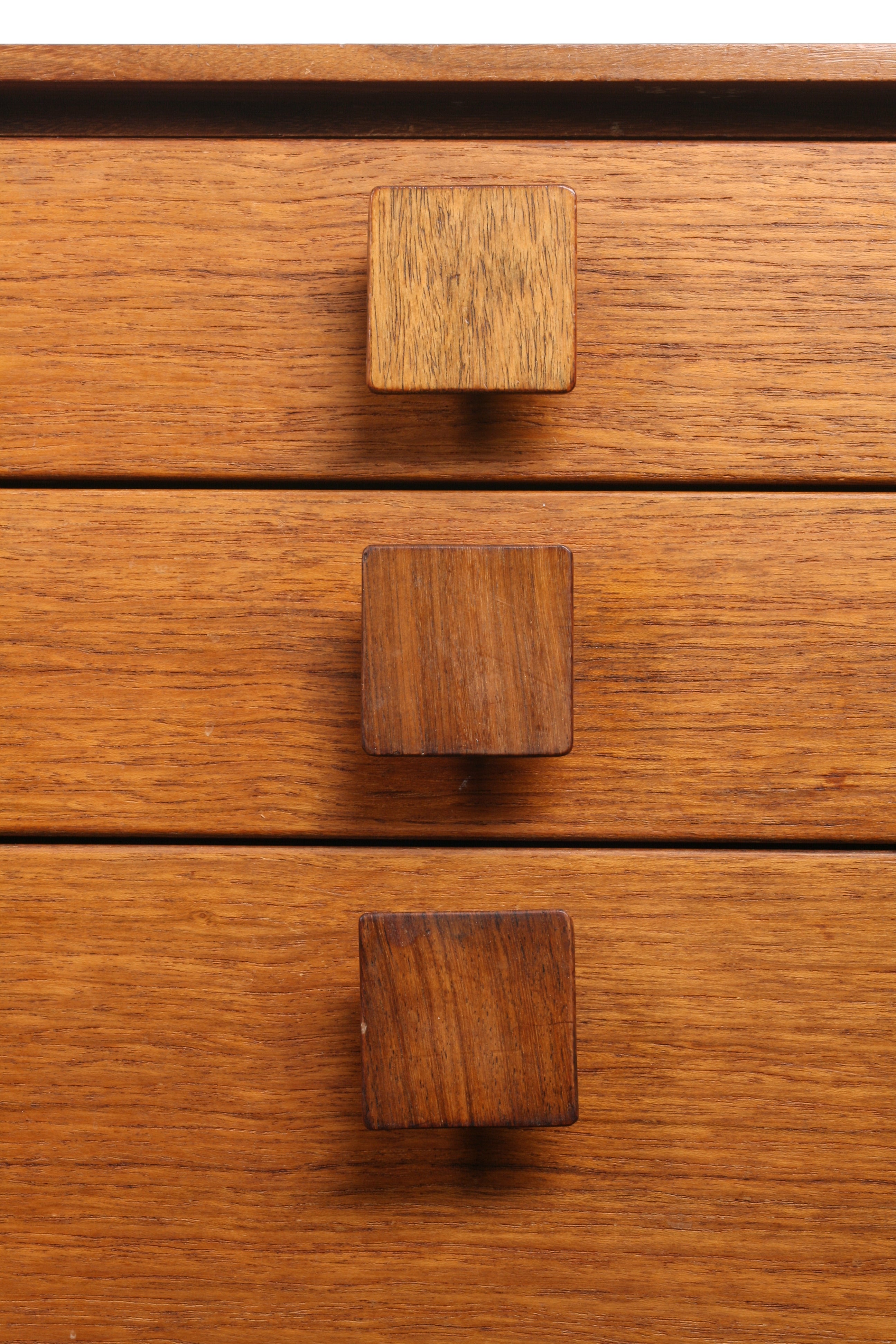 Mid Century teak sideboard closeup on drawer handles.