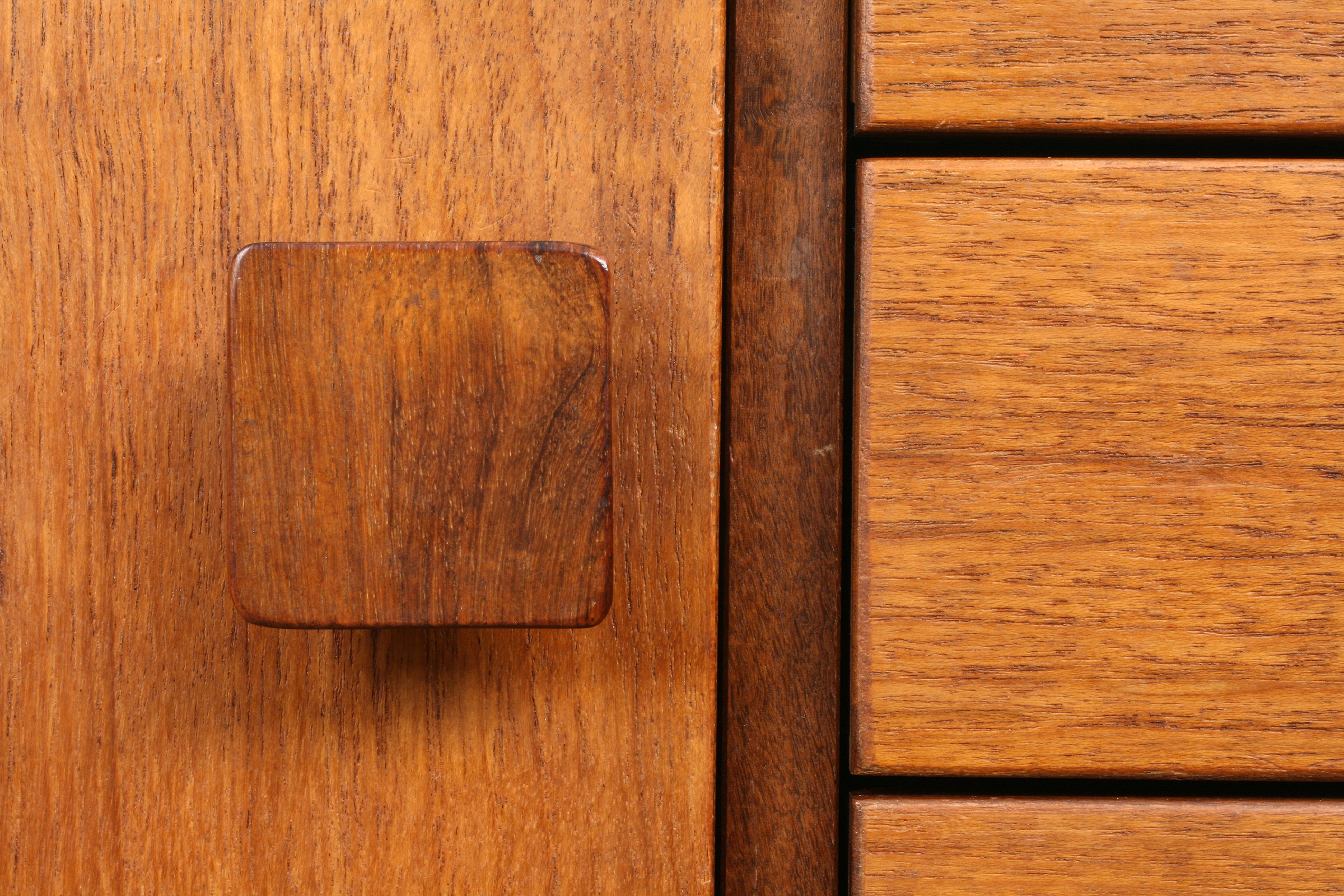 Mid Century teak sideboard closeup of one of the distinctive square rosewood handles.