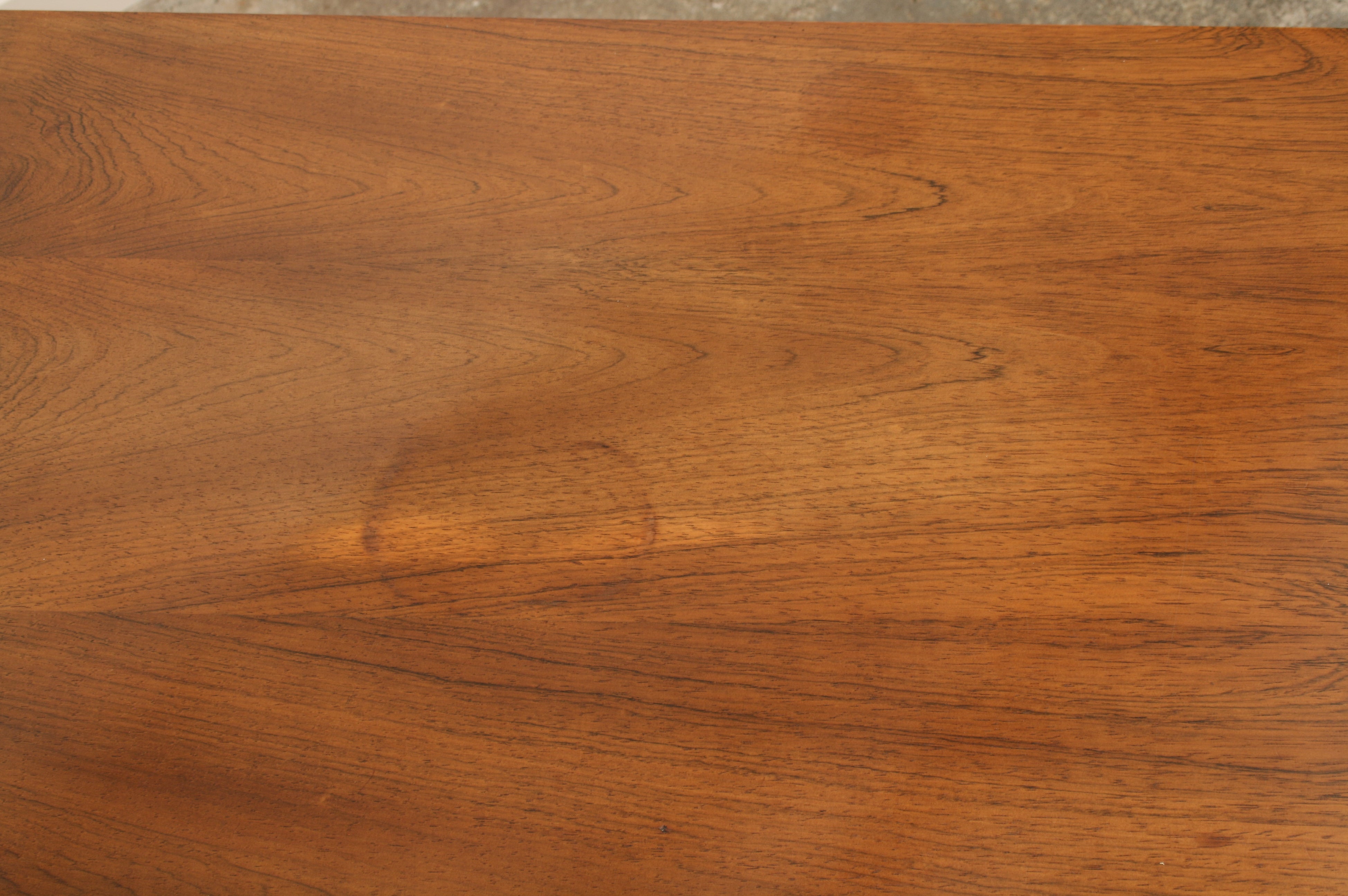 Rosewood sideboard close up of top showing some light ring marking.
