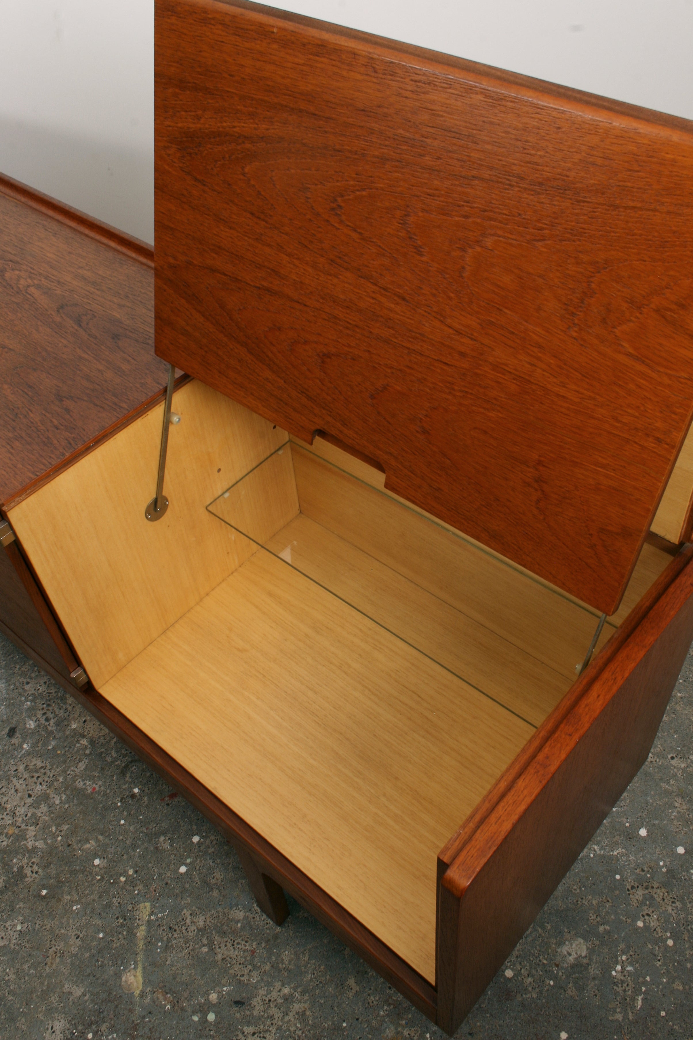 Meredew Mid Century Teak Sideboard showing open maple cabinet interior from above.