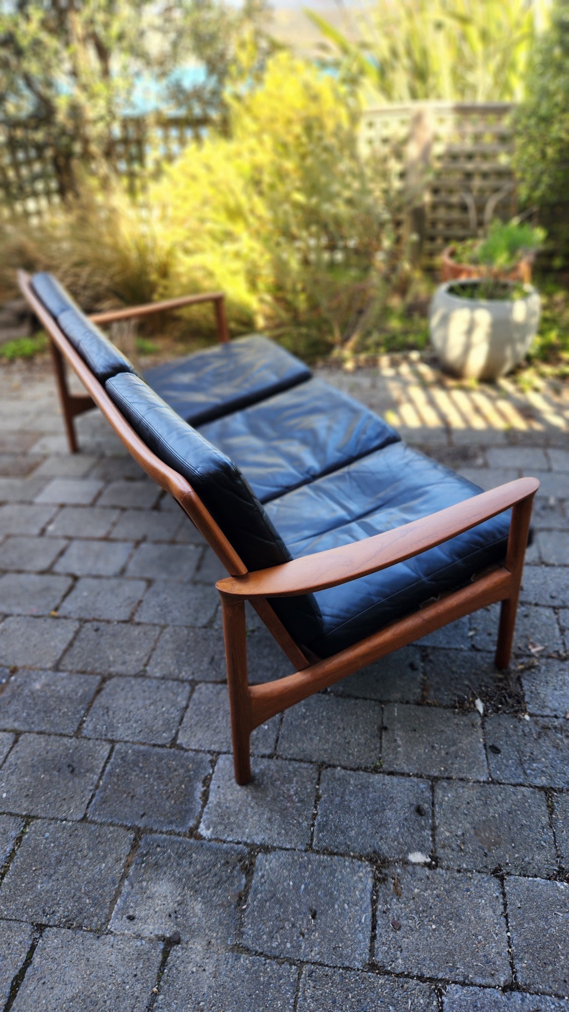 Teak Mid Century sofa by Mann Mobler of West Germany. Seen from above with leather cushions.