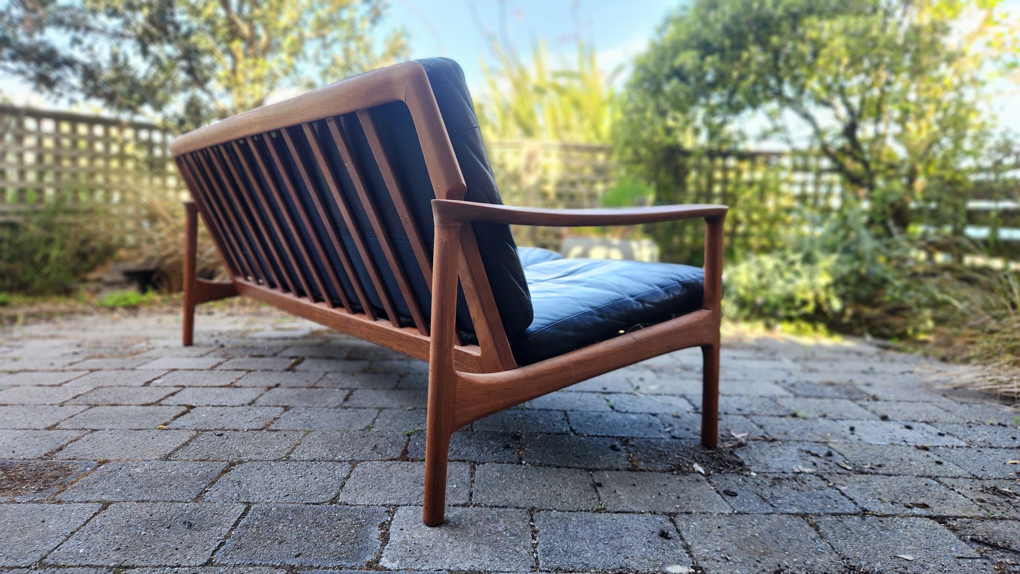 Teak Mid Century sofa by Mann Mobler of West Germany. Seen from rear