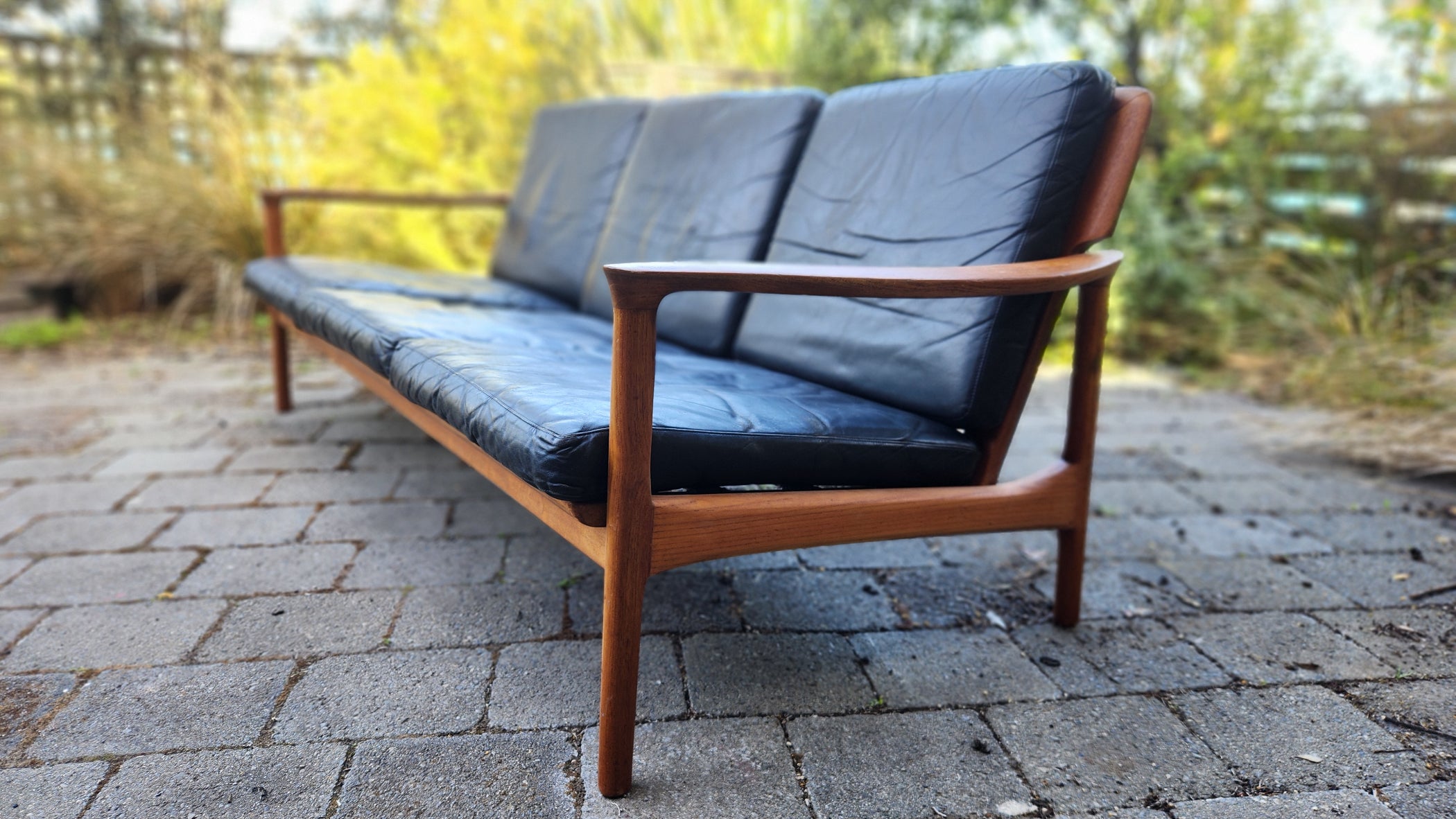 Teak Mid Century sofa by Mann Mobler of West Germany. 