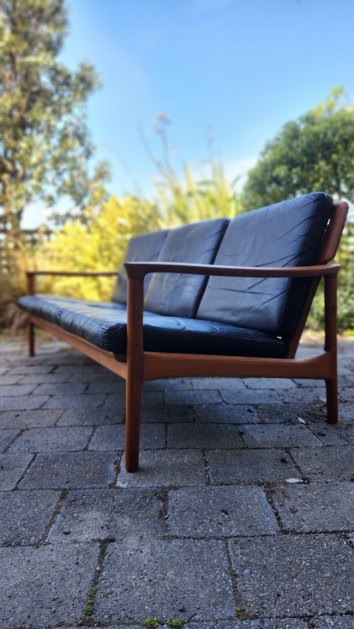 Teak Mid Century sofa by Mann Mobler of West Germany. profile.