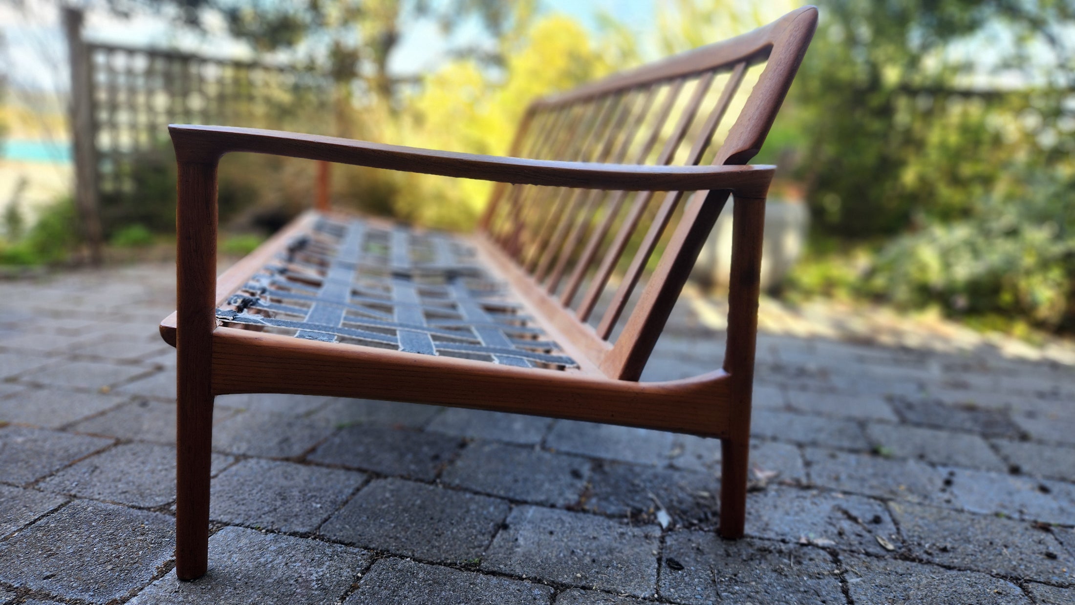 Teak Mid Century sofa by Mann Mobler of West Germany. side profile.
