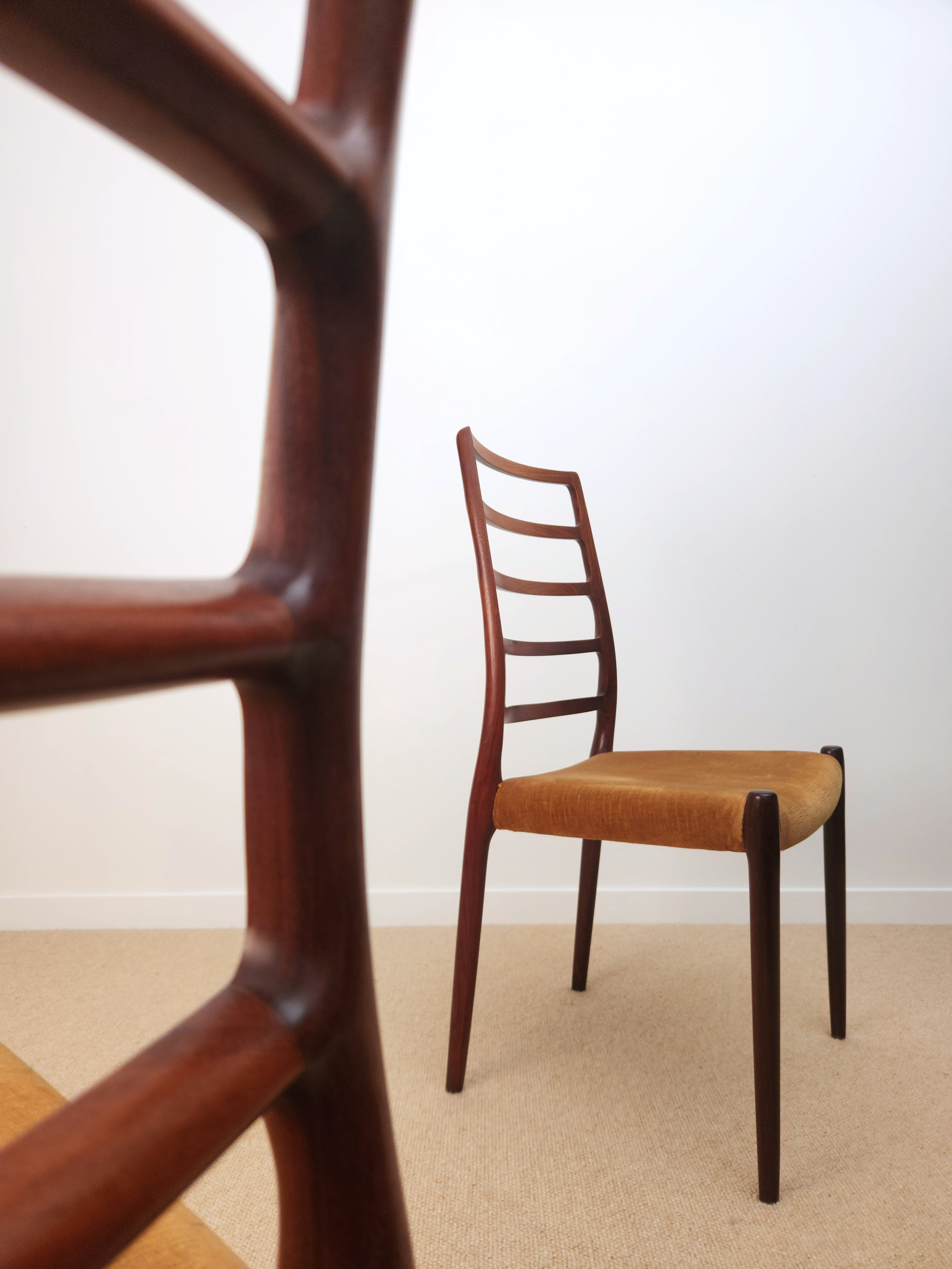 Moller Danish chairs closeup of chair blurred.