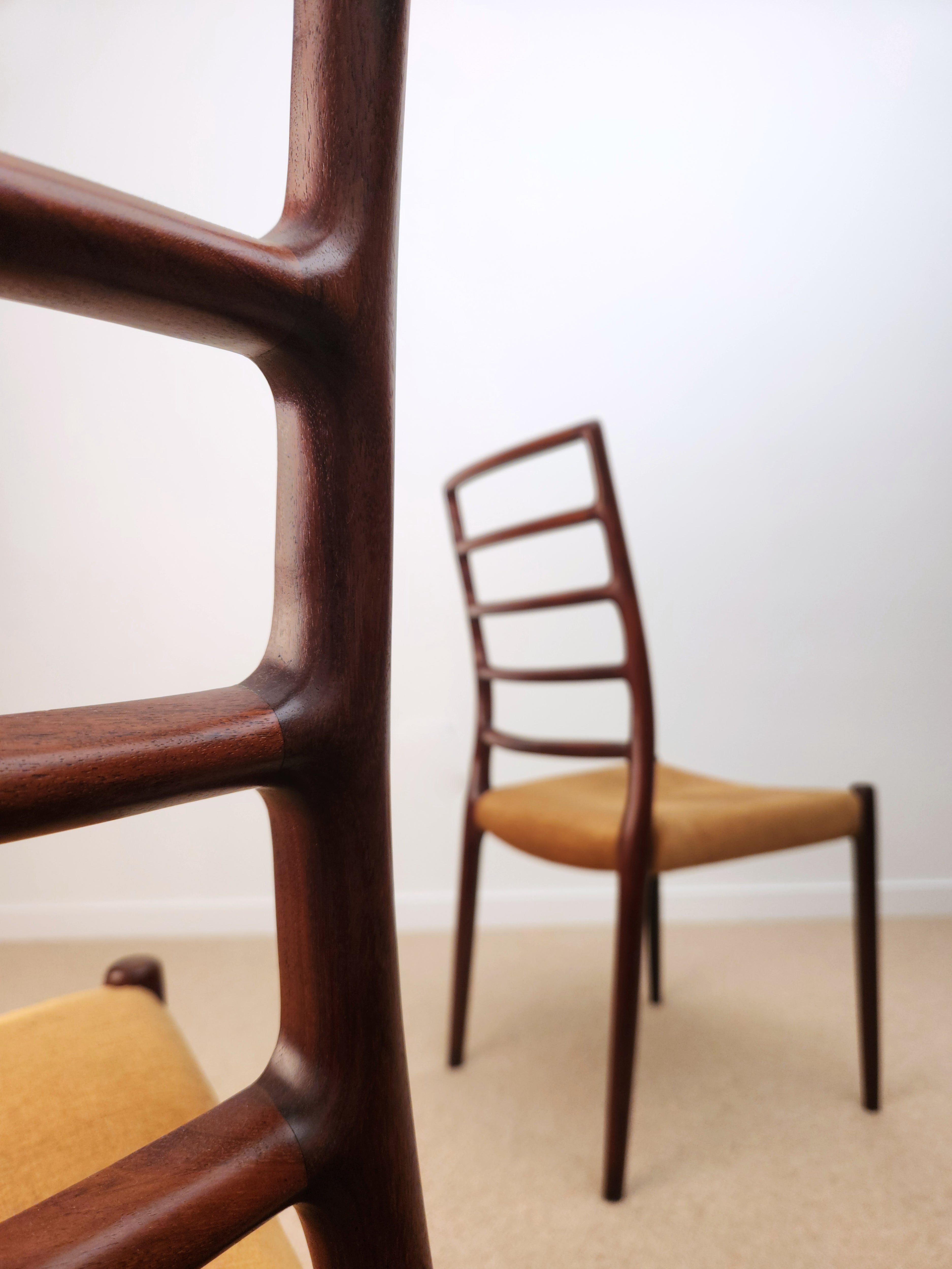 Moller Danish chairs closeup in focus.