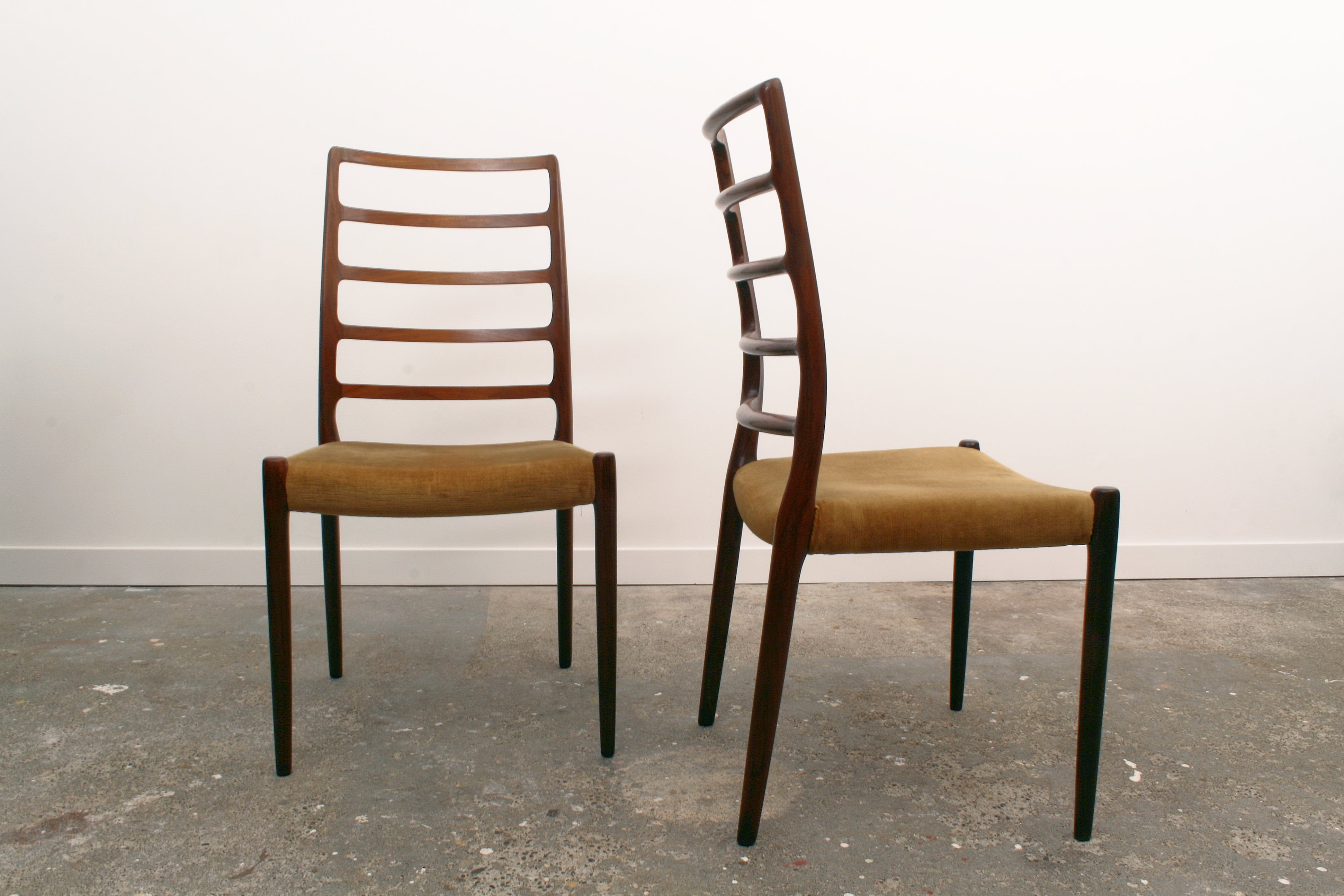 Moller Danish chairs pair one facing forward one facing right