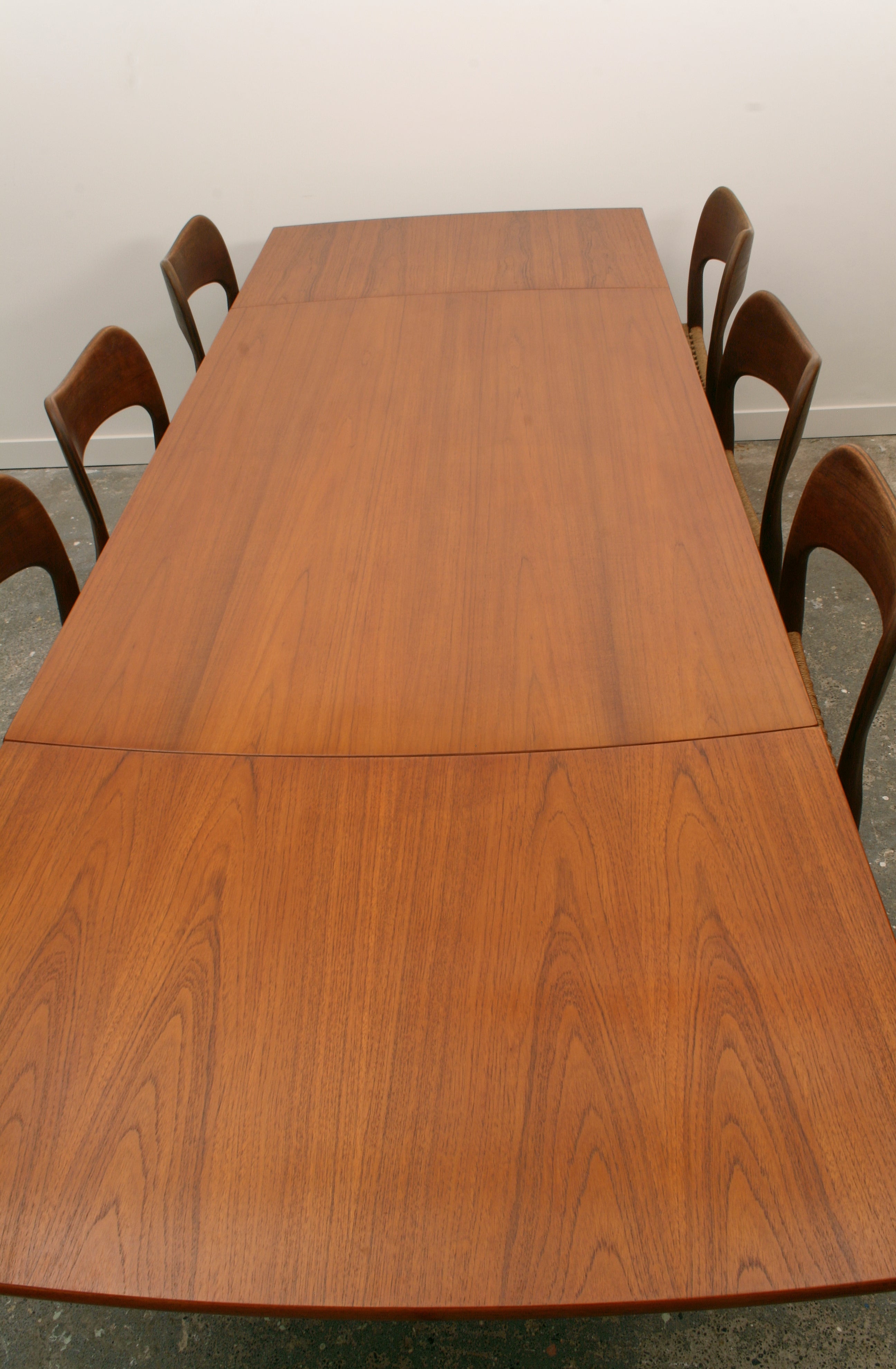 Mid Century Teak Dining Table extended looking down length. Highlighting excellent veneer condition.