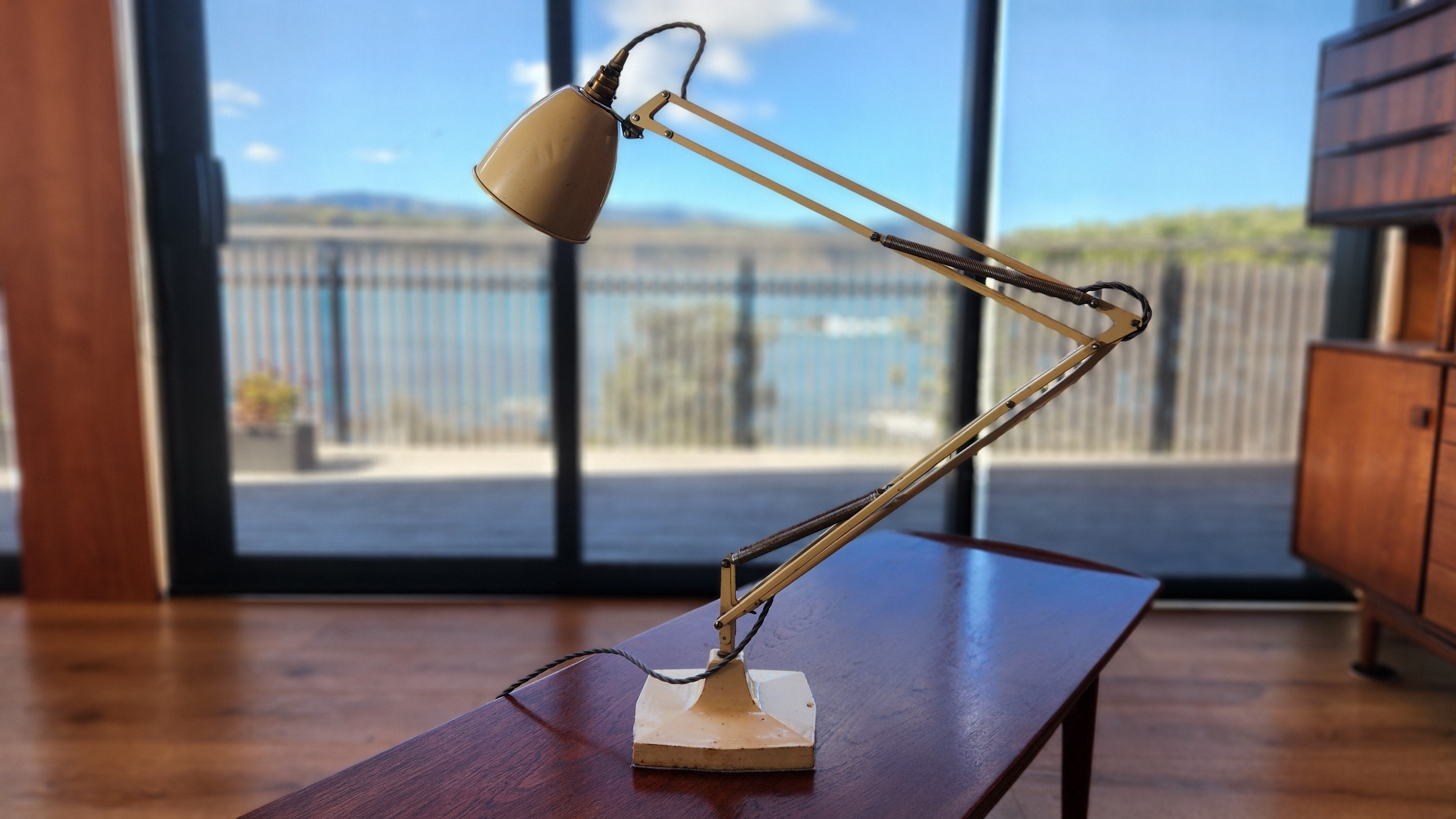 A cream coloured mid century anglepoise lamp by Herbert Terry. A model 1209. 